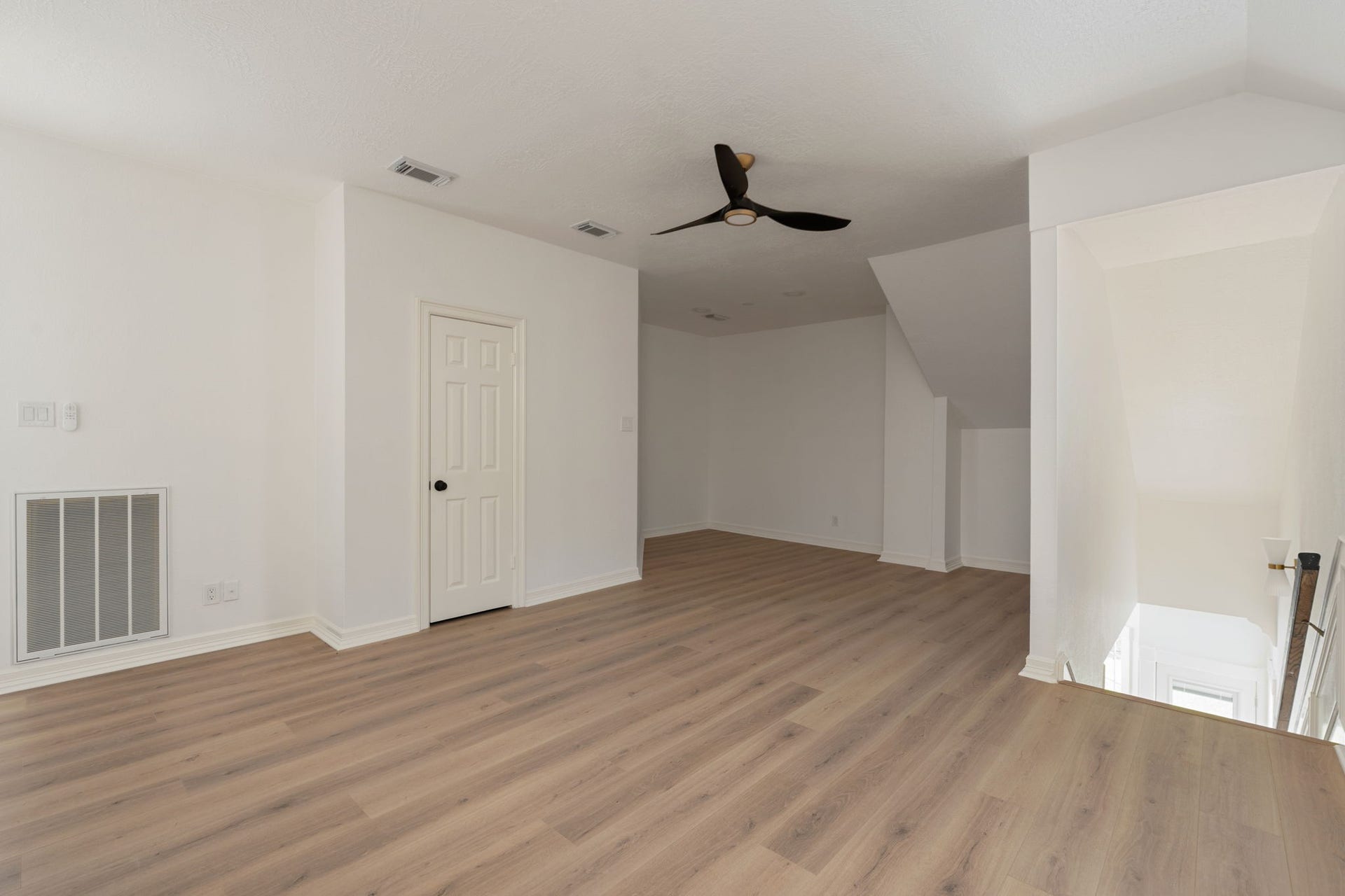 Positioned between the upstairs bedrooms, the flex space provides additional room for everyday living, workspace needs, or entertainment use. Open connections to the surrounding second-floor areas enhance the homes overall flow. Contemporary finishes and natural light continue throughout the space.