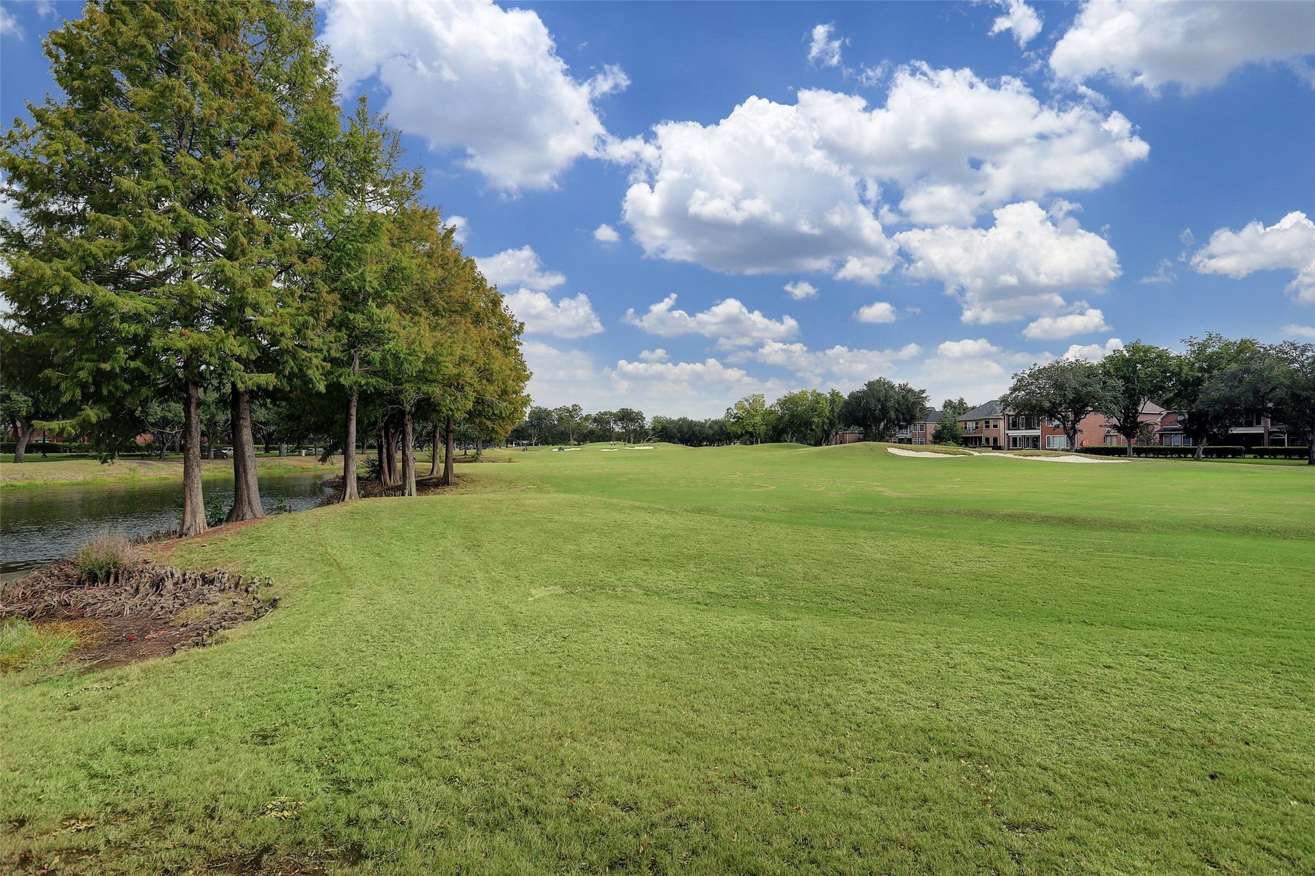 Expansive green space and mature trees create a peaceful setting within Sweetwaters golf course community in Sugar Land. The neighborhood is known for its established landscaping, wide streets, and country club atmosphere. Residents enjoy convenient access to the Tournament Players Club golf courses and nearby community amenities.