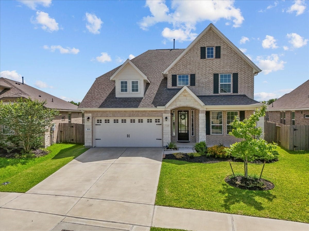 Stunning two-story home with brick and stone elevation with no back neighbors and water views