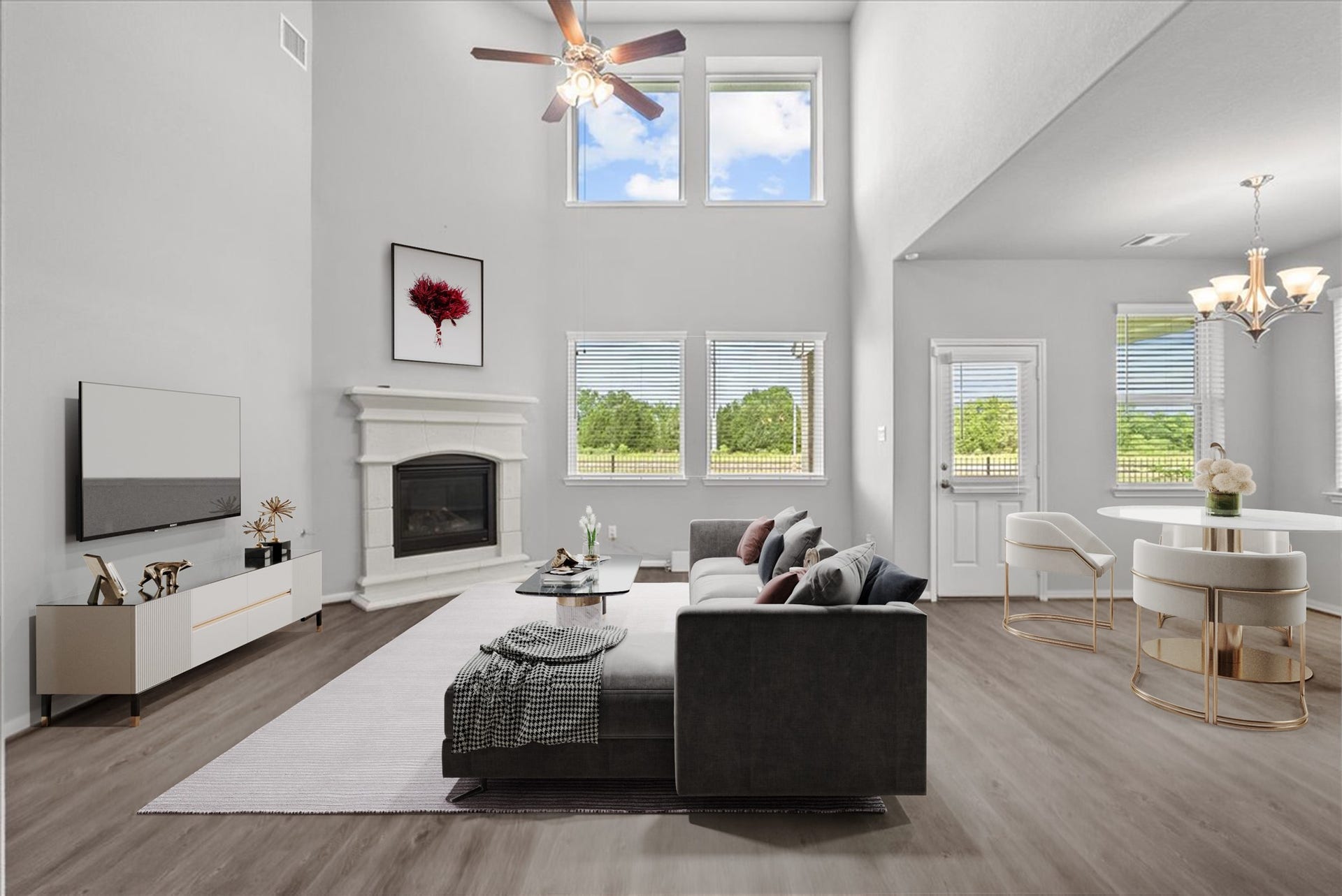 Living room features two-story ceilings and a cozy fireplace for those cold winter nights