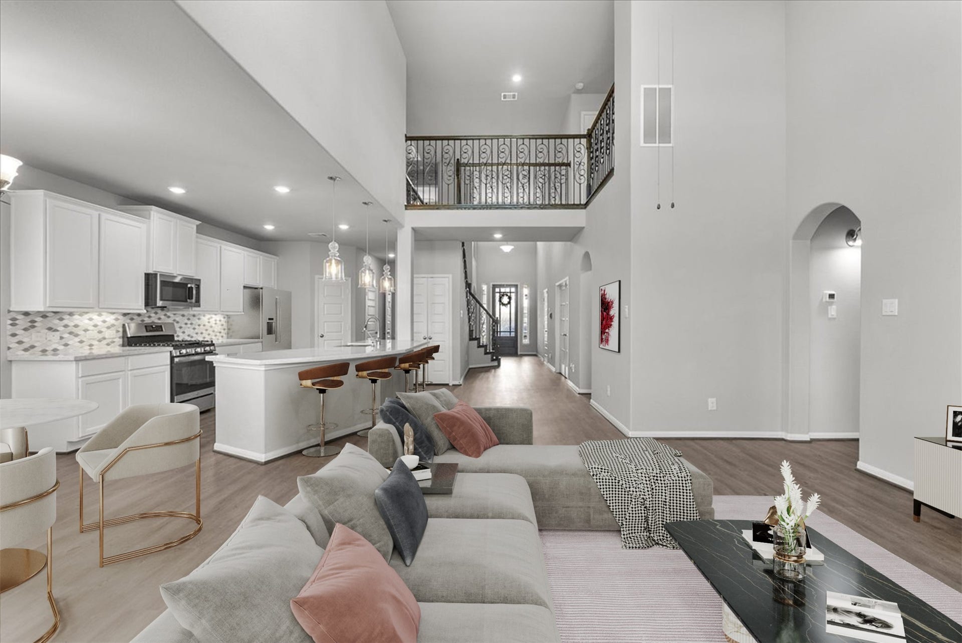 Living room features two-story ceilings and a cozy fireplace for those cold winter nights