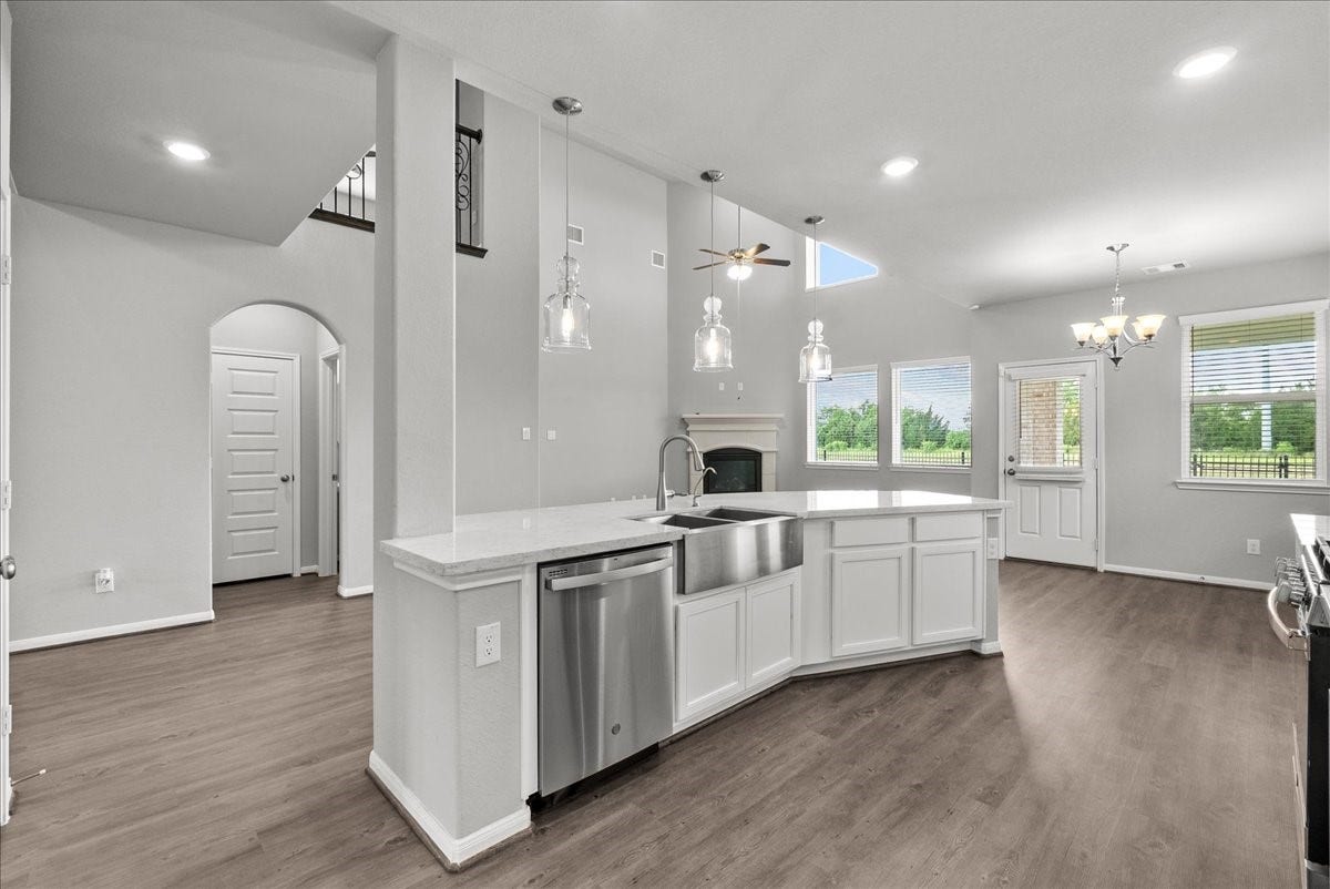 Chef's eat-in island kitchen features 42" cabinets with crown molding, stainless steel appliances and and designer backsplash