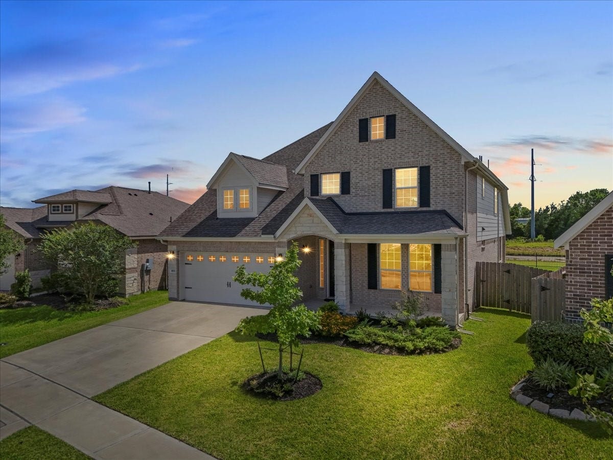 Stunning two-story home with brick and stone elevation with no back neighbors and water views