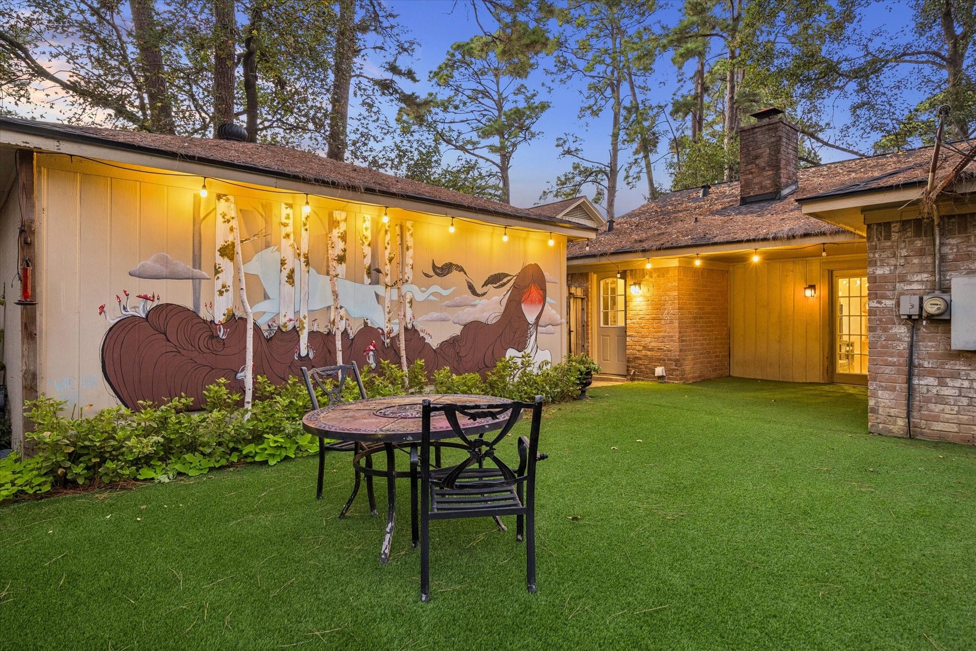 10411 Grassland Circle, Houston, TX 77070 The back yard is lovely and the detached garage features a whimsical and very attractive mural.