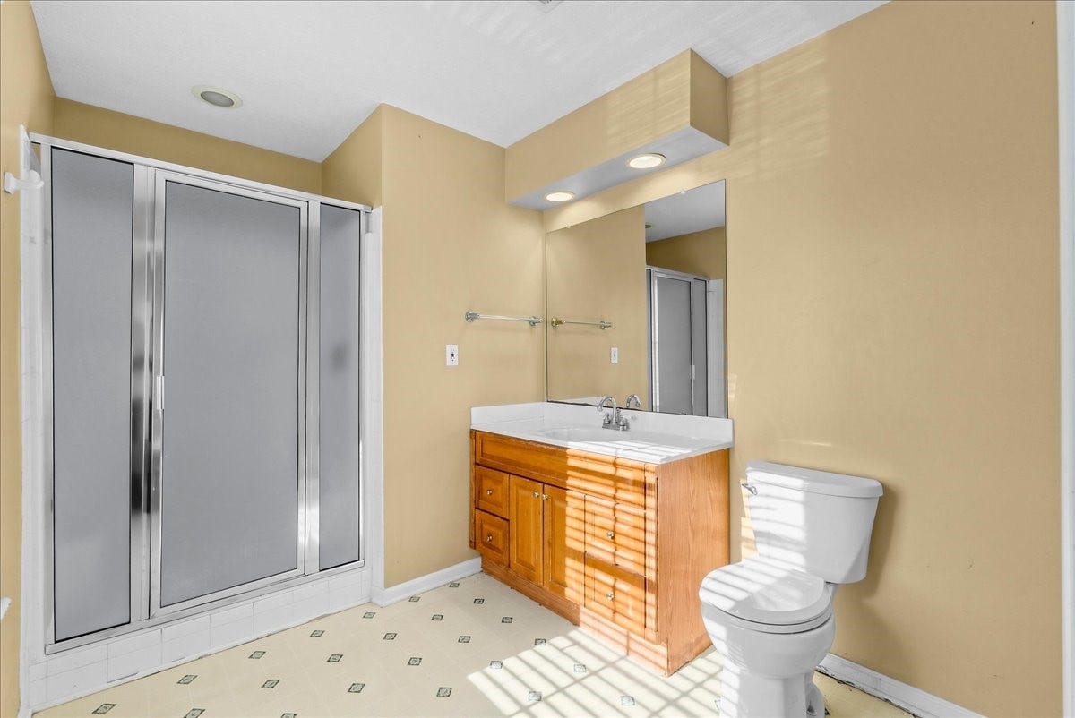 Discover the convenience of a well-appointed garage apartment bathroom featuring a sleek shower, ample vanity space, and modern fixtures for ultimate comfort and style.