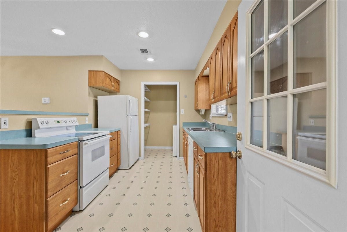 Charming and functional, this garage apartment kitchen offers ample cabinetry, modern appliances, and a cozy layout perfect for convenient living or entertaining.