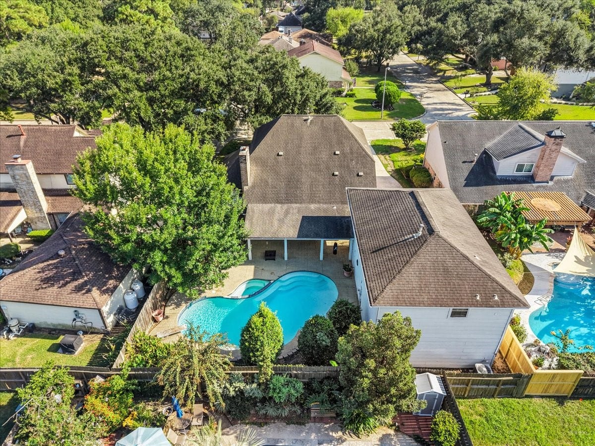 Charming home with a spacious backyard featuring a sparkling pool, surrounded by lush landscaping for privacy and relaxation. Perfect for outdoor entertaining.