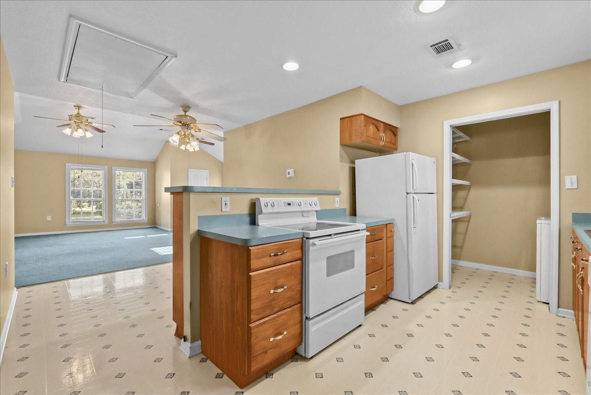 Bright and spacious, this garage apartment kitchen offers ample cabinetry, modern appliances, and an open layout perfect for comfortable living.