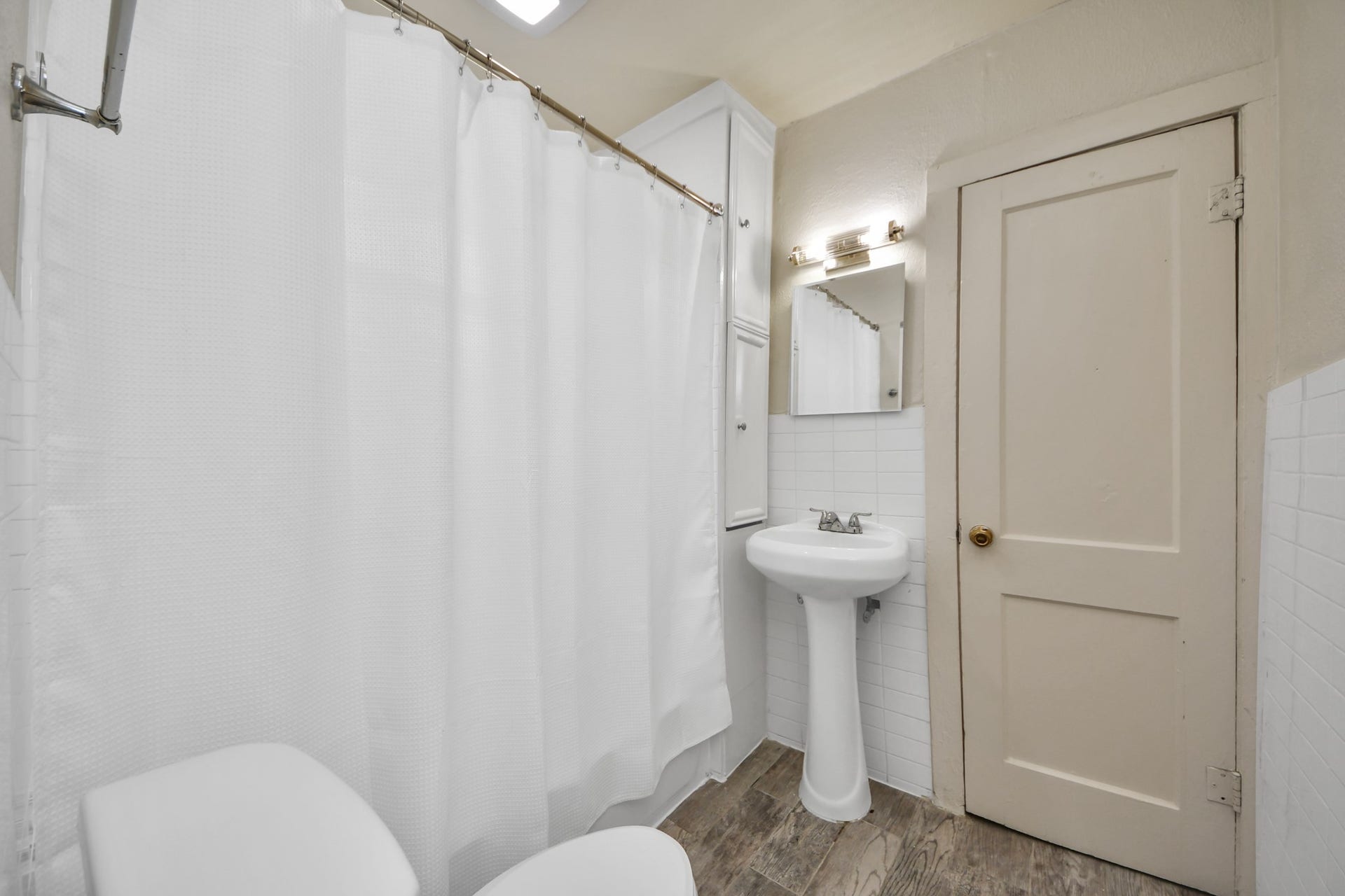 A well-appointed Jack-and-Jill bathroom conveniently connects both bedrooms, offering privacy and functionality.