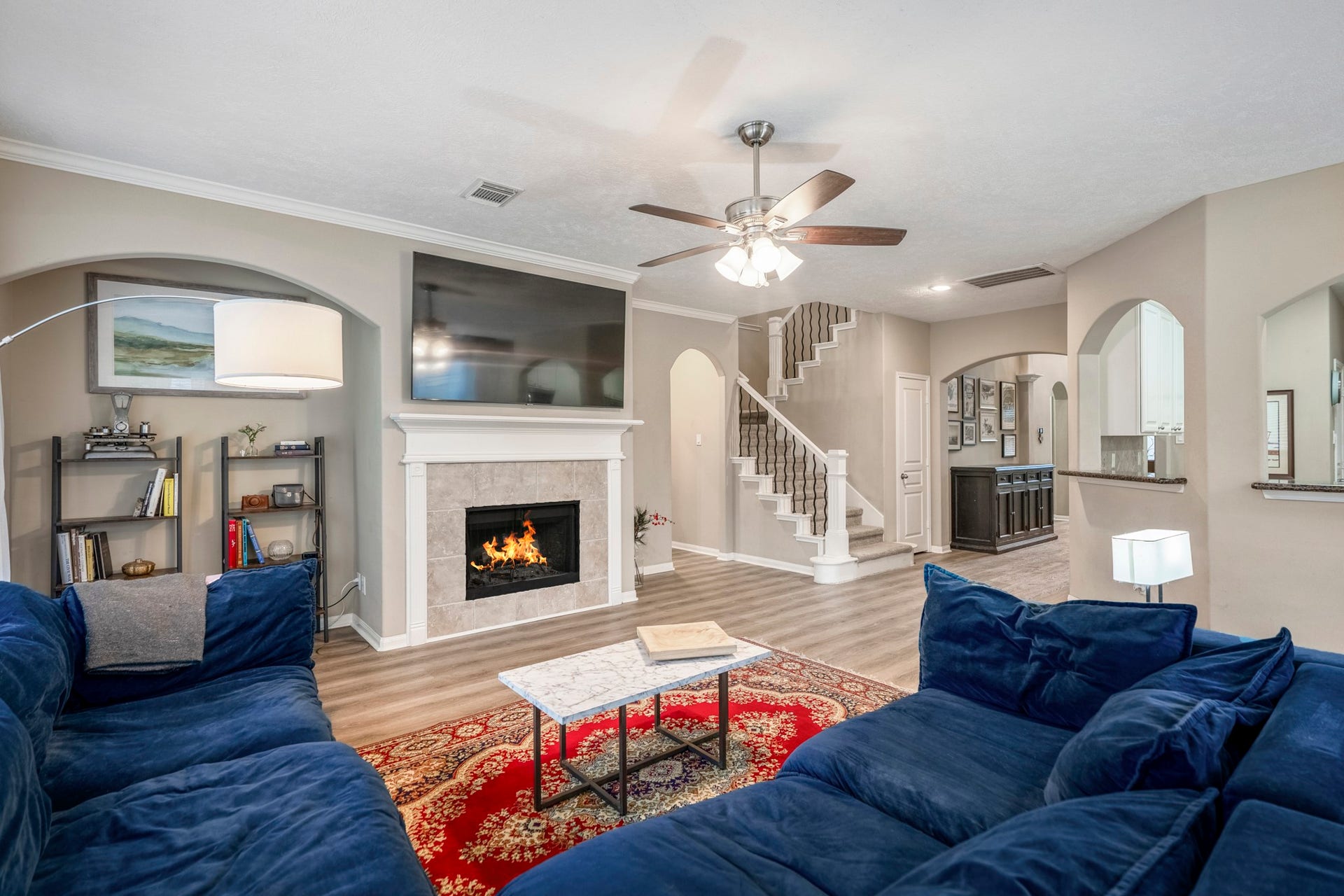 Cozy up around the fireplace in this open floorplan