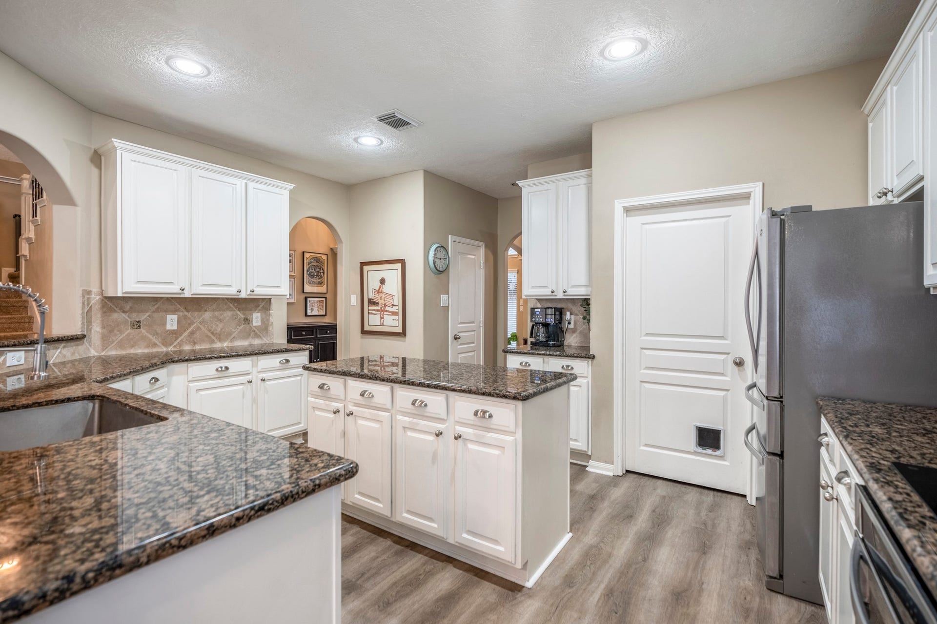 Generous countertop space and find the laundry room through that door