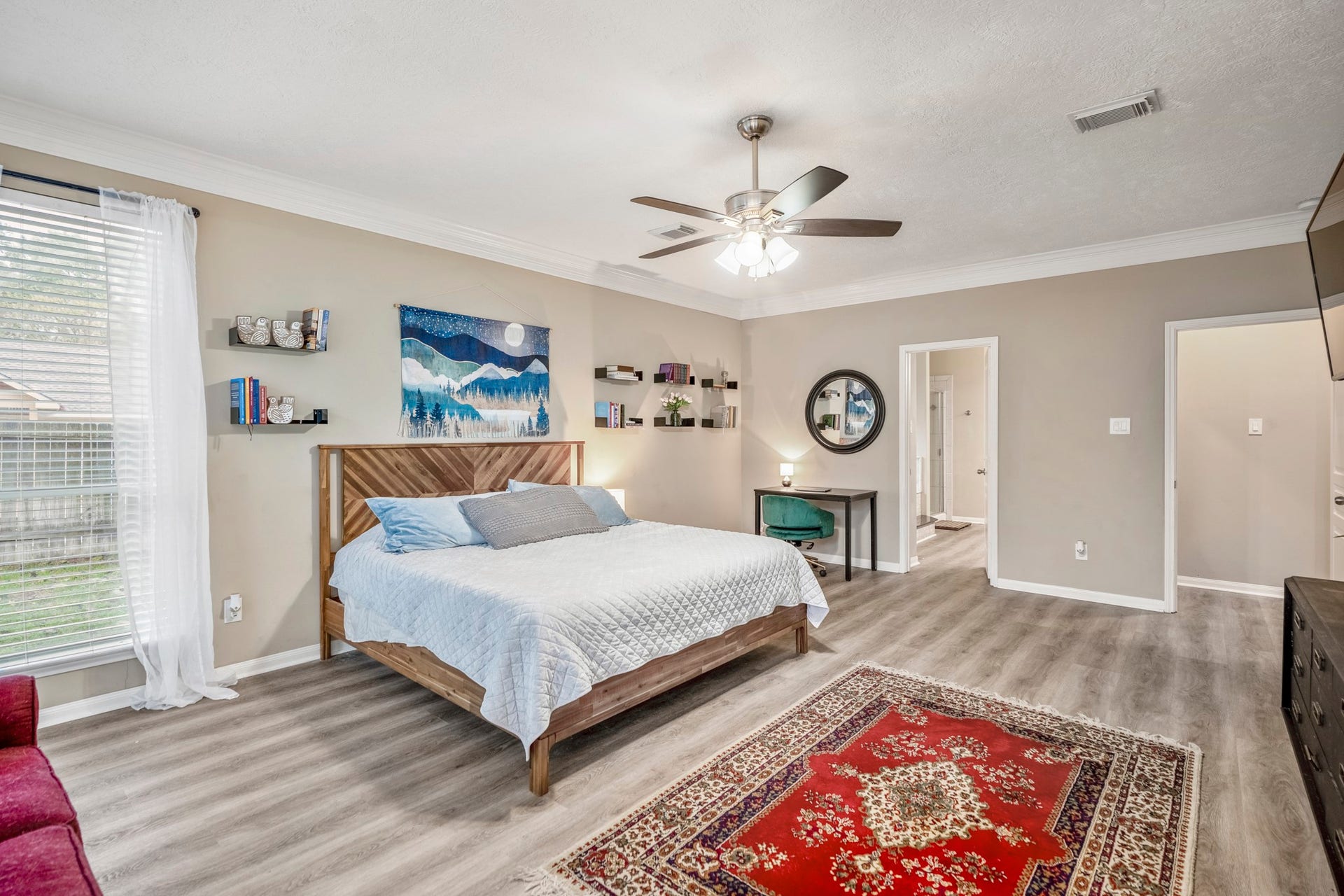 Expansive primary suite with room for additional seating