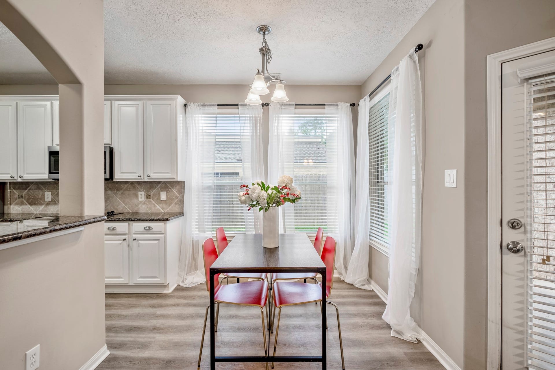 Breakfast room just off the kitchen and find your back covered patio through that door