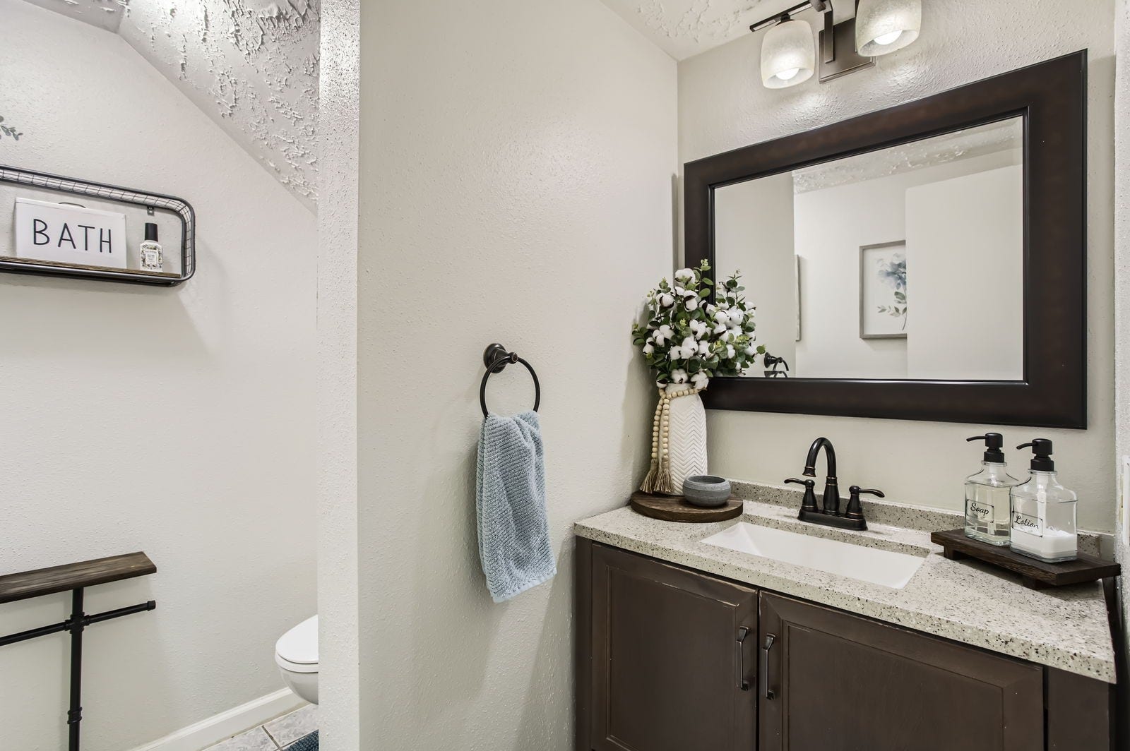 The adorable updated half bathroom is just past the entry.