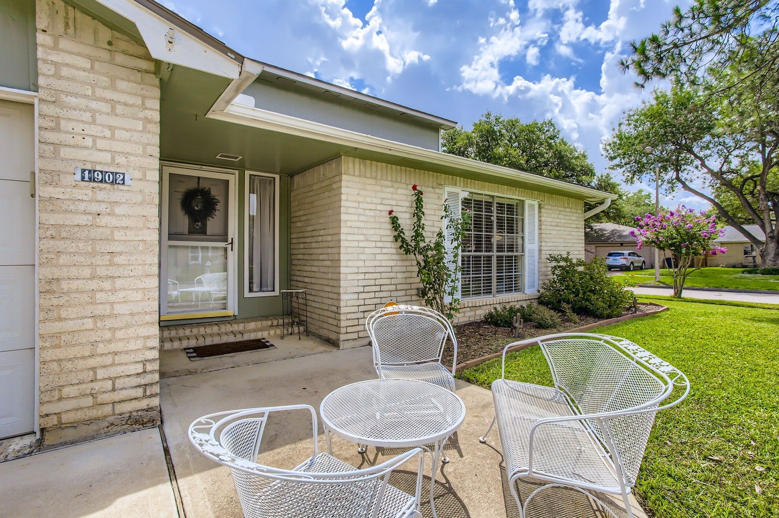 This home greets you with a cozy front patio, where you can wind down at the end of the day and wave to the neighbors!