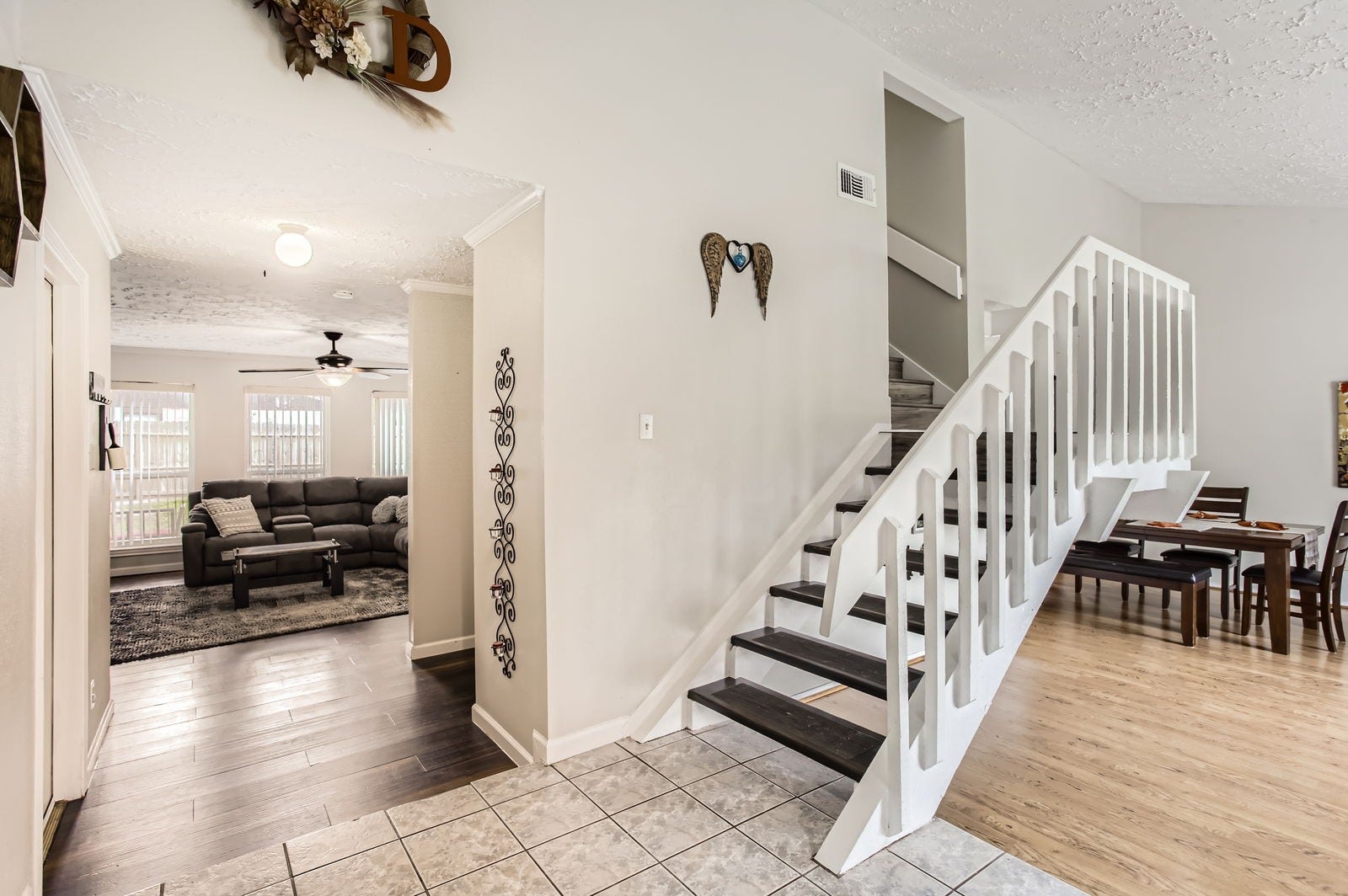 You are greeted with a tiled entry, with formals to your right and the family room directly in front of you.