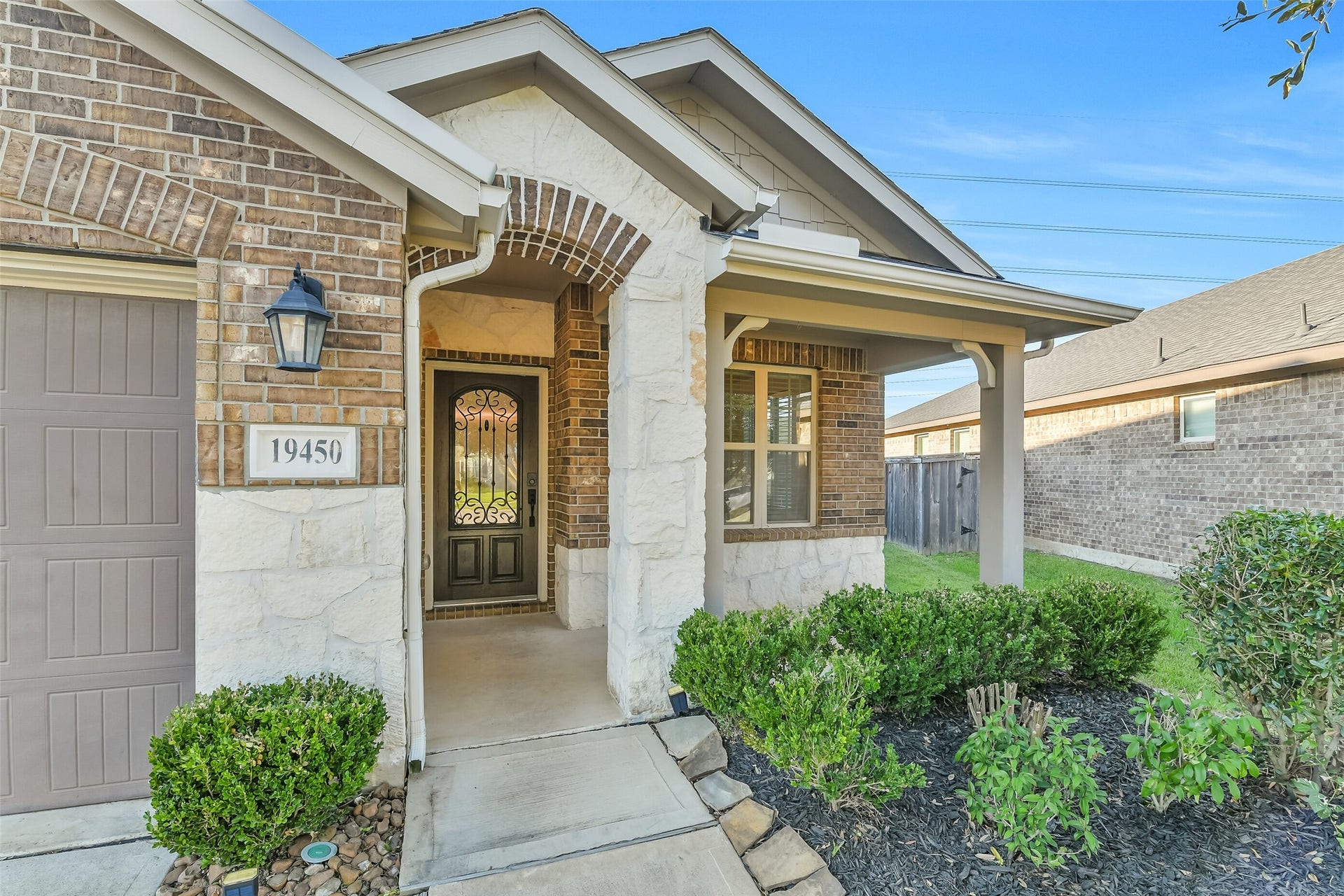 19450 Tobiano Park Drive, Tomball, TX 77377 A charming front porch welcomes you and visitors to this home in highly sought after Armia.