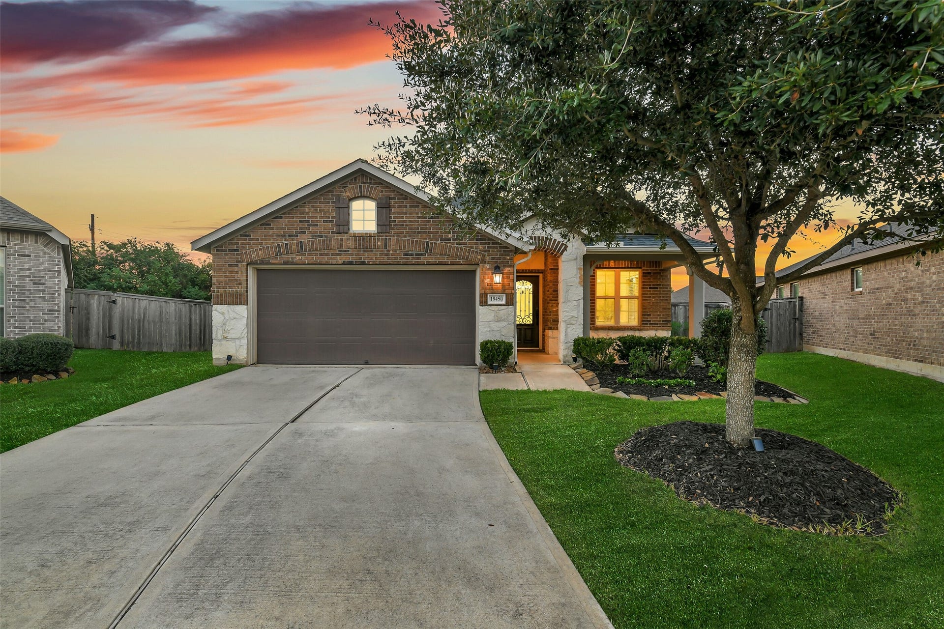 19450 Tobiano Park Drive, Tomball, TX 77377 Mature landscaping in the front yard includes a beautiful full oak.