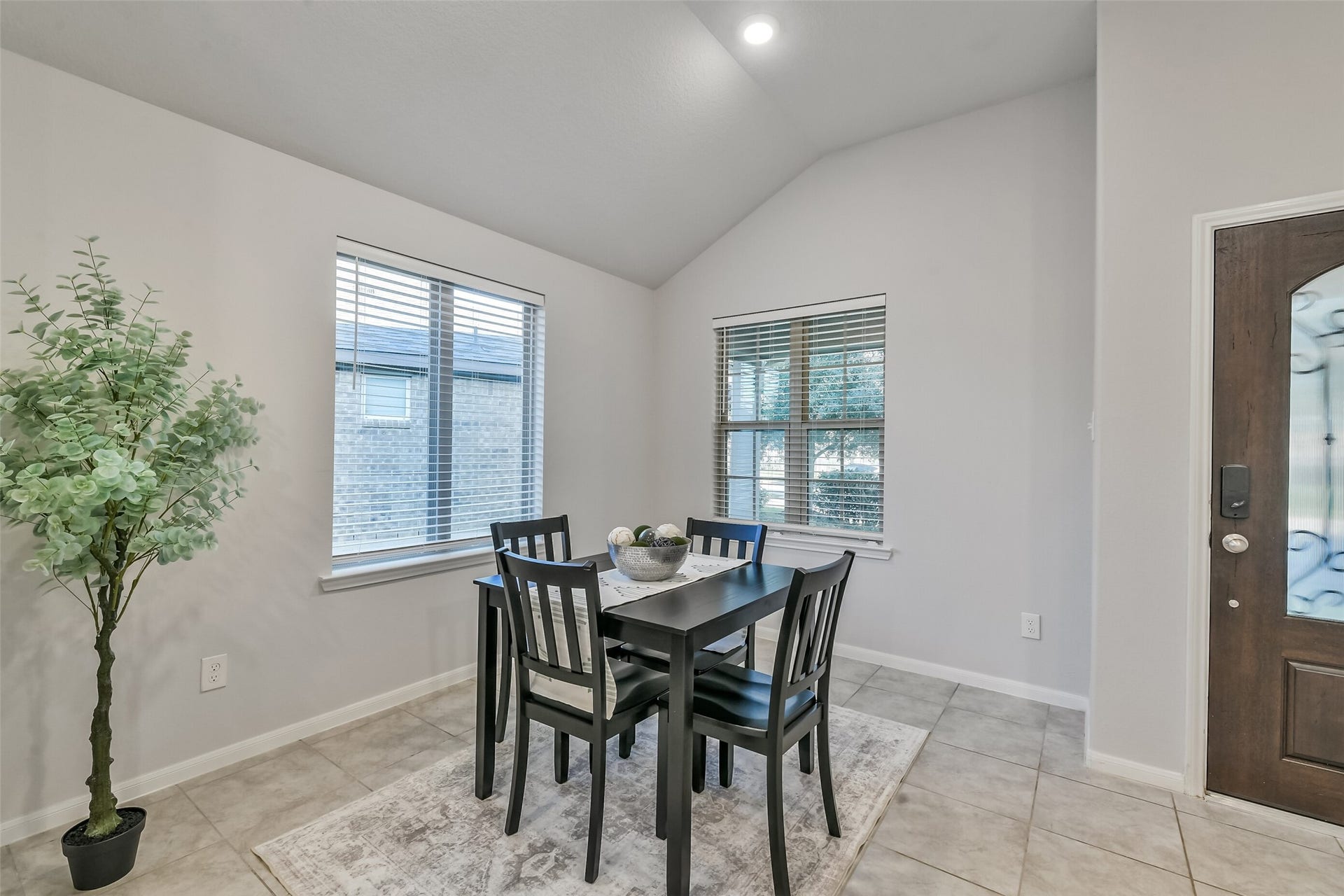 19450 Tobiano Park Drive, Tomball, TX 77377 Natural light from the windows brightens this dining area.