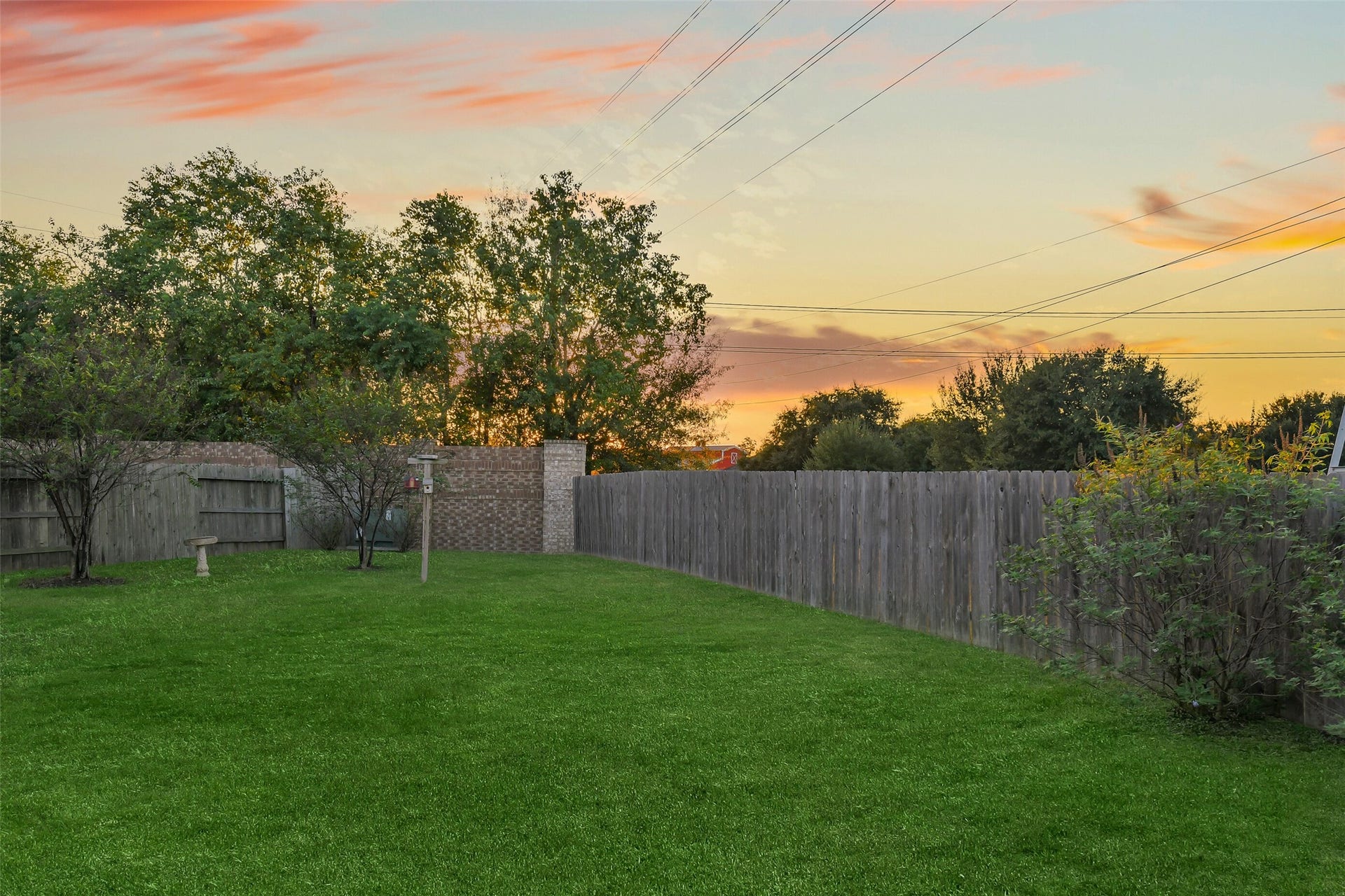 19450 Tobiano Park Drive, Tomball, TX 77377 Fully fenced in backyard is ideal for entertaining.