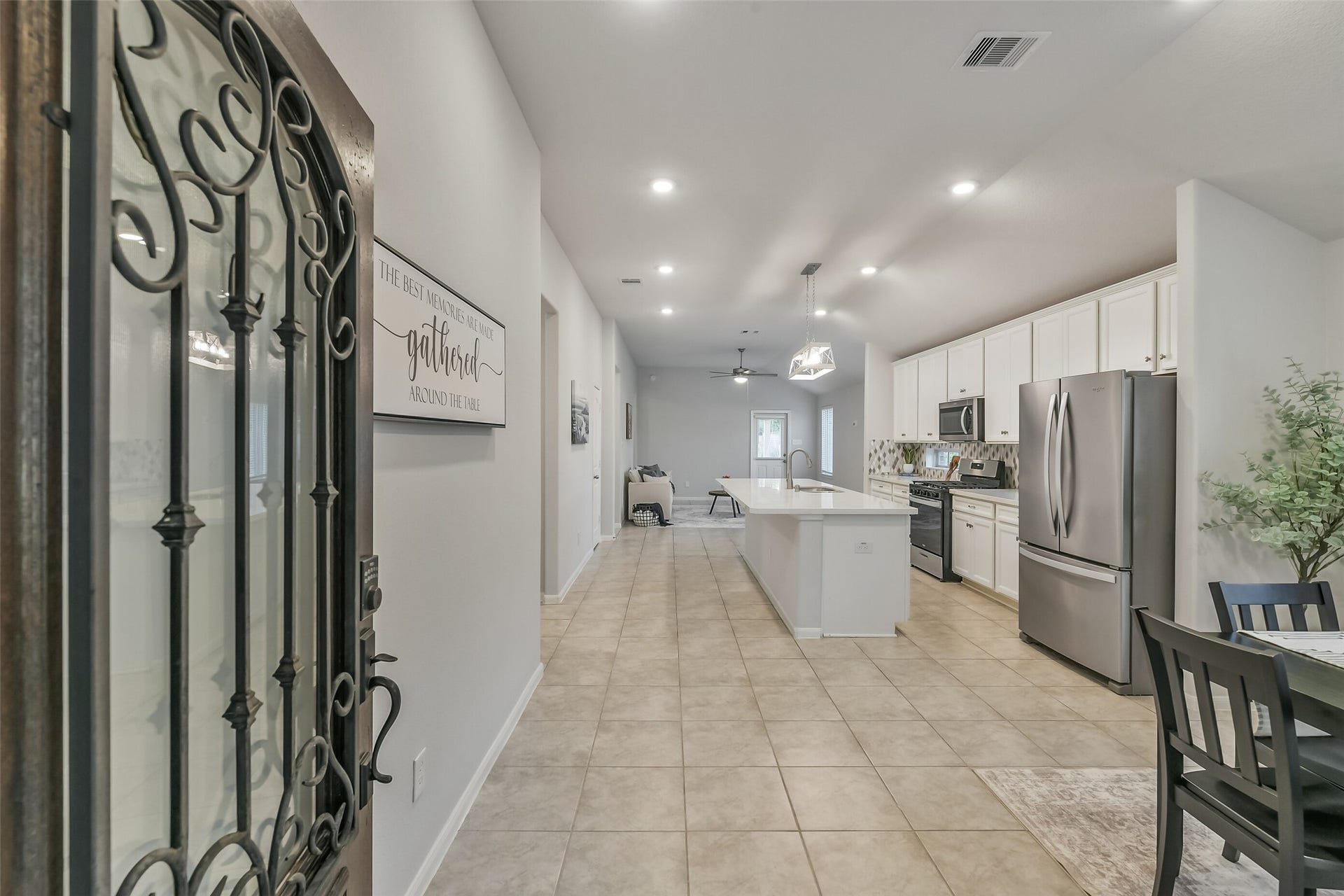 19450 Tobiano Park Drive, Tomball, TX 77377 A wood and glass door opens to the breakfast room and kitchen.
