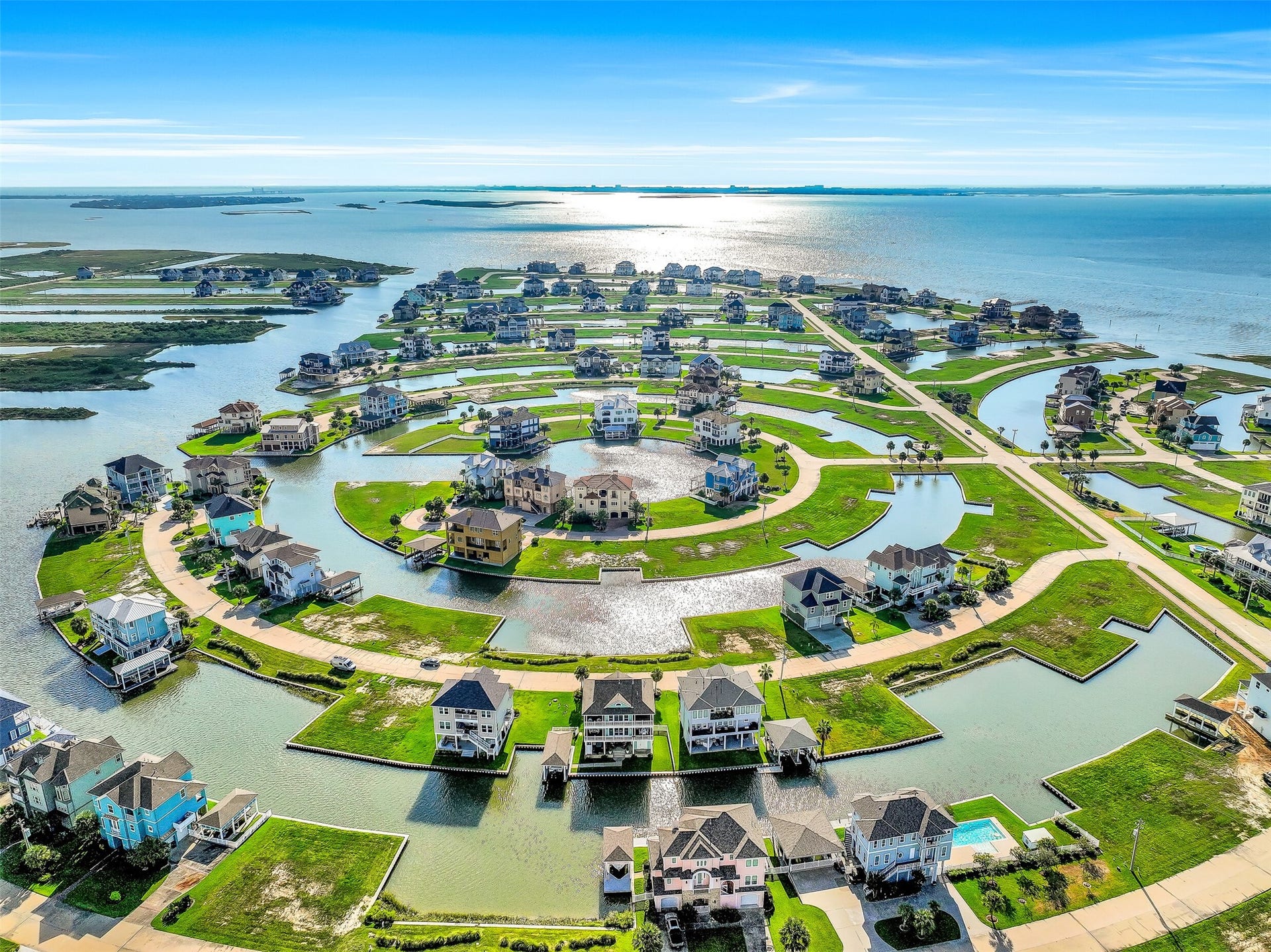 12 Fleming, Hitchcock, TX 77563 The aerial view tells you everything you need to know about Harborwalk. A stunning network of canals winds through the community, putting boaters just minutes from open water. 12 Fleming sits right on the canal with a private boathouse, 30-foot lift, and rebuilt dock positioned perfectly for the water lifestyle this community was built around.