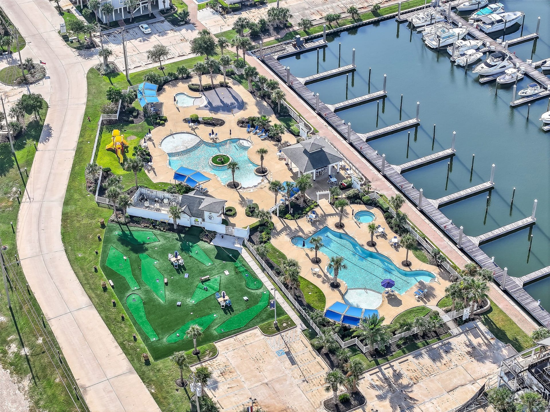12 Fleming, Hitchcock, TX 77563 Nestled inside Harborwalk's Flamingo Isle a gated, manned-entry waterfront community with a full-service marina, ship store, yacht club, hike and bike trails, and a community lodge. The lifestyle here starts before you even walk through the front door.