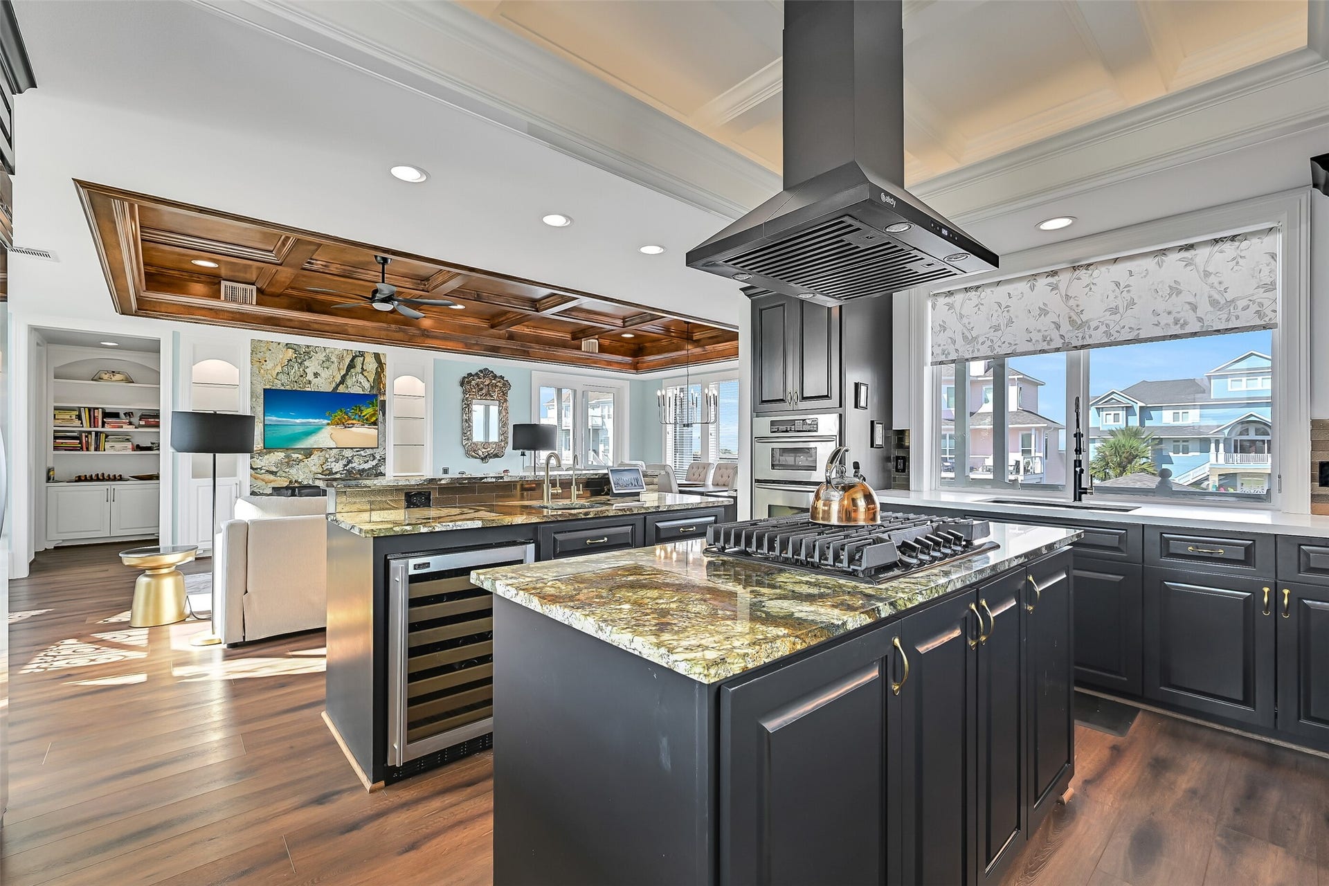 12 Fleming, Hitchcock, TX 77563 Cook with a water view. The open-concept kitchen flows directly to the dining area and connecting balconies so the Gulf Coast lifestyle is always part of the experience.