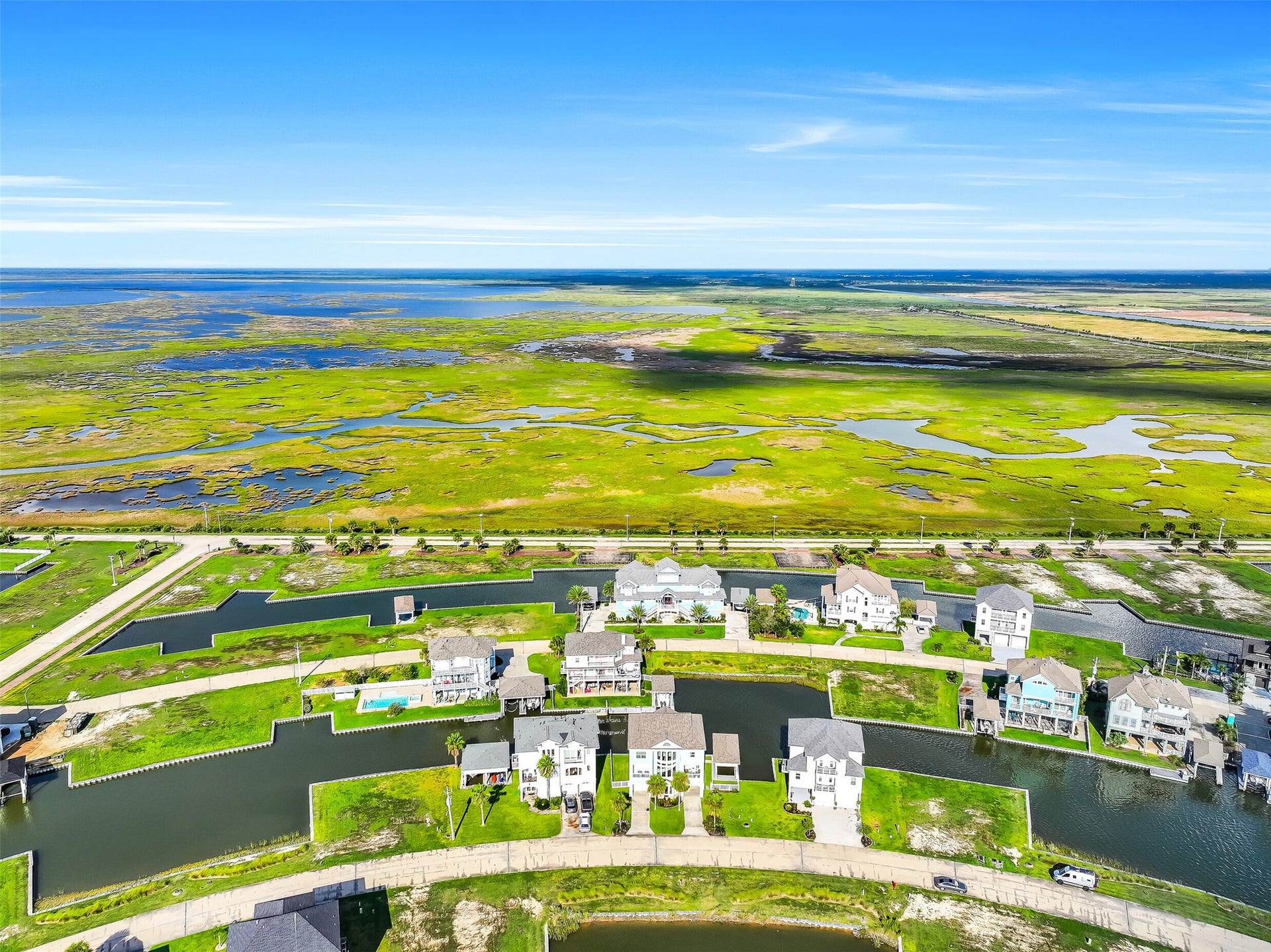 12 Fleming, Hitchcock, TX 77563 From above, the story of 12 Fleming becomes clear. Nestled inside Harborwalk's Flamingo Isle, this canal-front home sits at the edge of the water with direct access to the Intracoastal Waterway and Galveston Bay surrounded by one of the most beautifully planned waterfront communities on the Texas Gulf Coast.