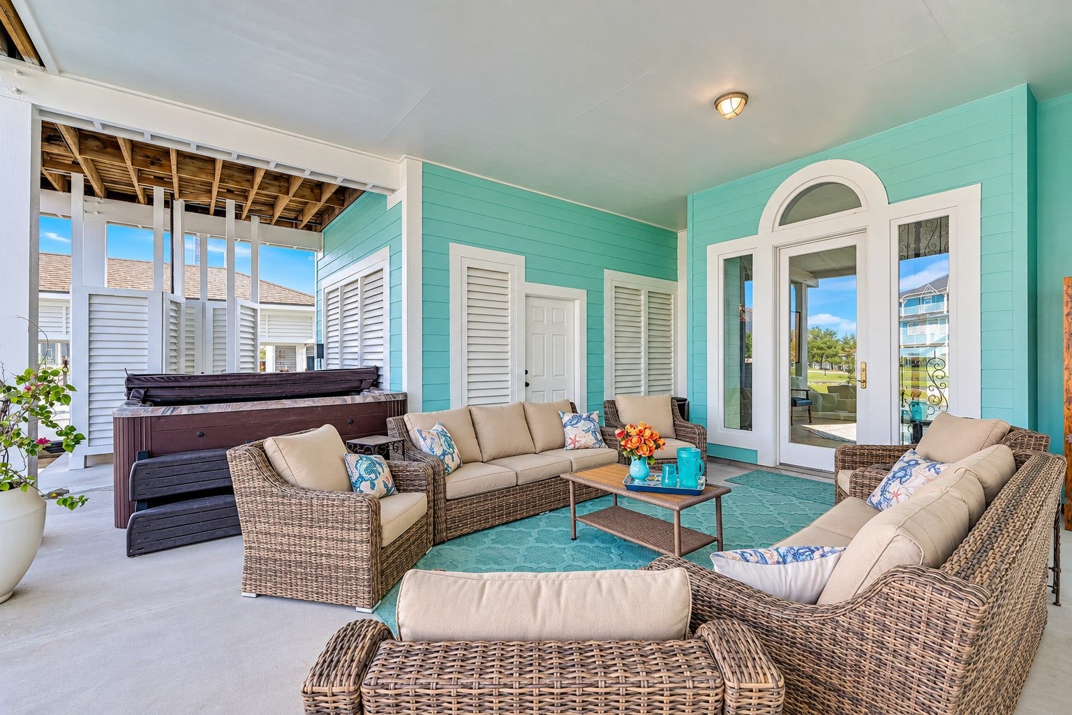 12 Fleming, Hitchcock, TX 77563 The outdoor living does not stop at the water's edge. The expansive covered lower patio at 12 Fleming is fully furnished and every piece stays with the home just move in and start living. An 8-person Sunbelt hot tub, outdoor shower, and direct dockside access make this the hub of Gulf Coast entertaining. Watch the boats pass, listen to the water, and host the kind of gatherings this space was made for. Everything is here. Everything is new. All you have to do is show up.