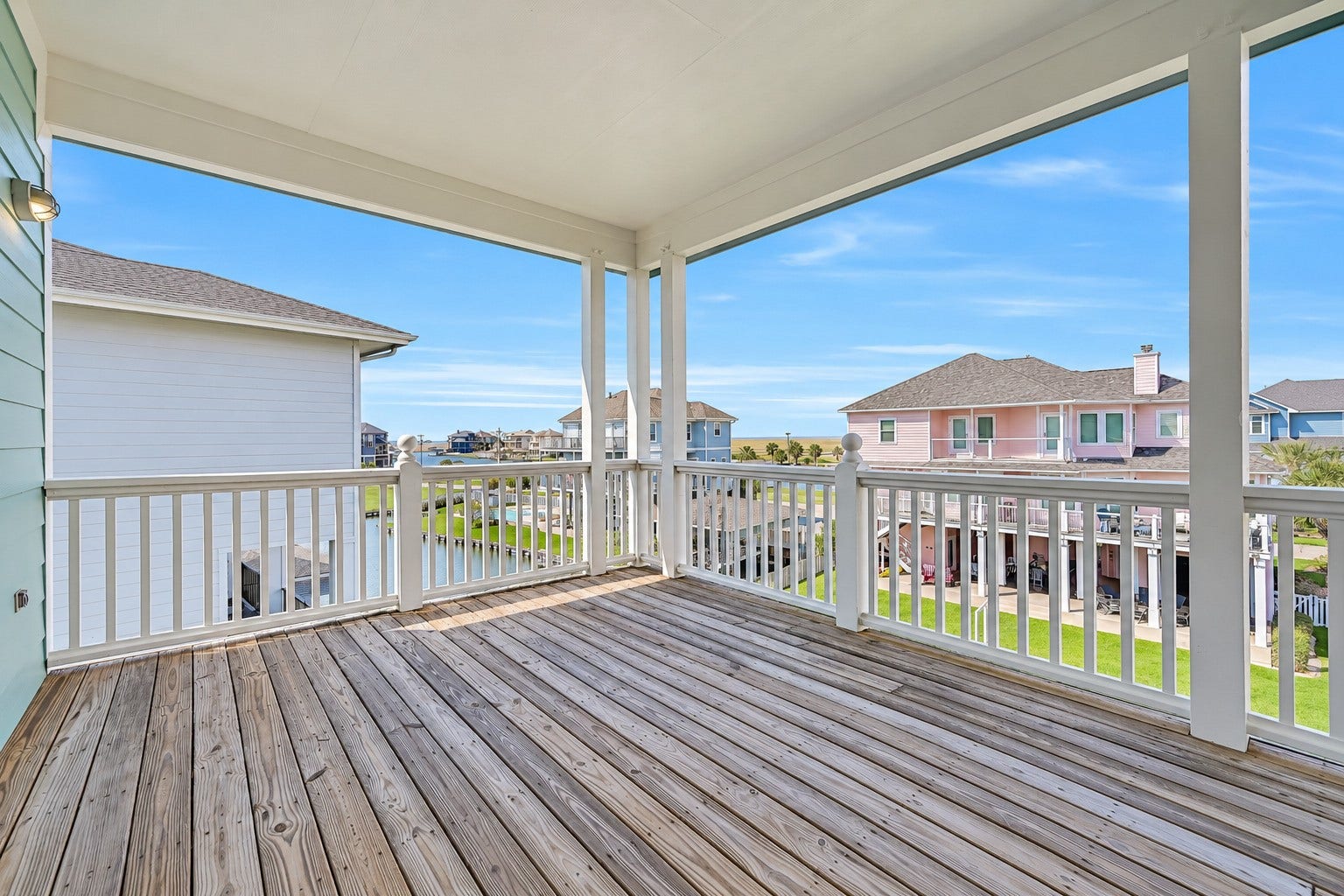 12 Fleming, Hitchcock, TX 77563 Five connecting balconies wrap this home at every level, creating an outdoor living experience that flows as naturally as the interior. Step outside from the living room, the dining area, the primary suite, or any guest room and you are immediately on the water with nothing between you and the canal but open Gulf Coast air.