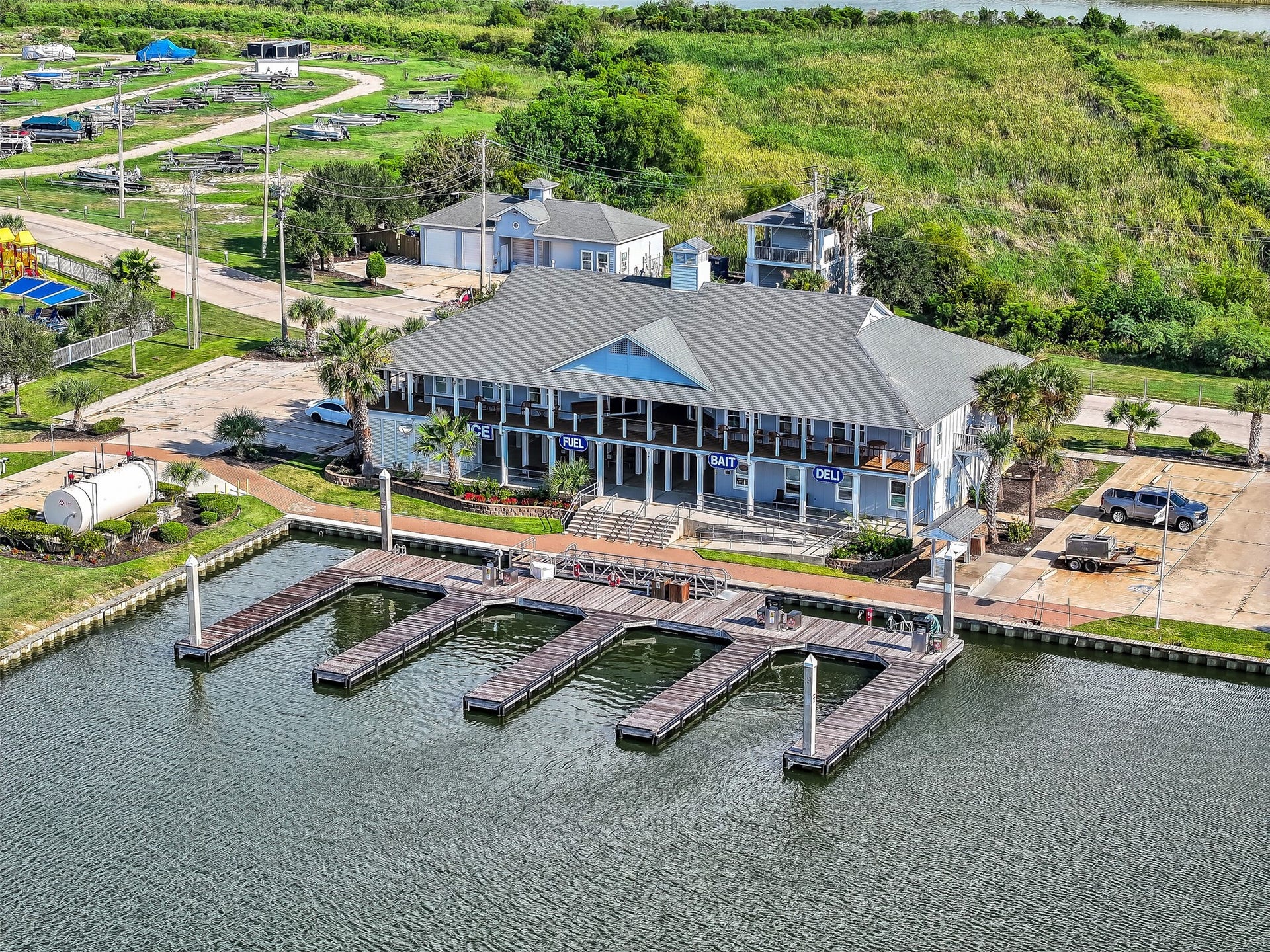 12 Fleming, Hitchcock, TX 77563 From up here you can see the full picture the canals, the community, the marina, the open water beyond, and right in the middle of it all, 12 Fleming. A completely reimagined luxury waterfront home in one of Galveston County's most sought-after gated communities. The aerial view just confirms what buyers already know this is exactly where they want to be.