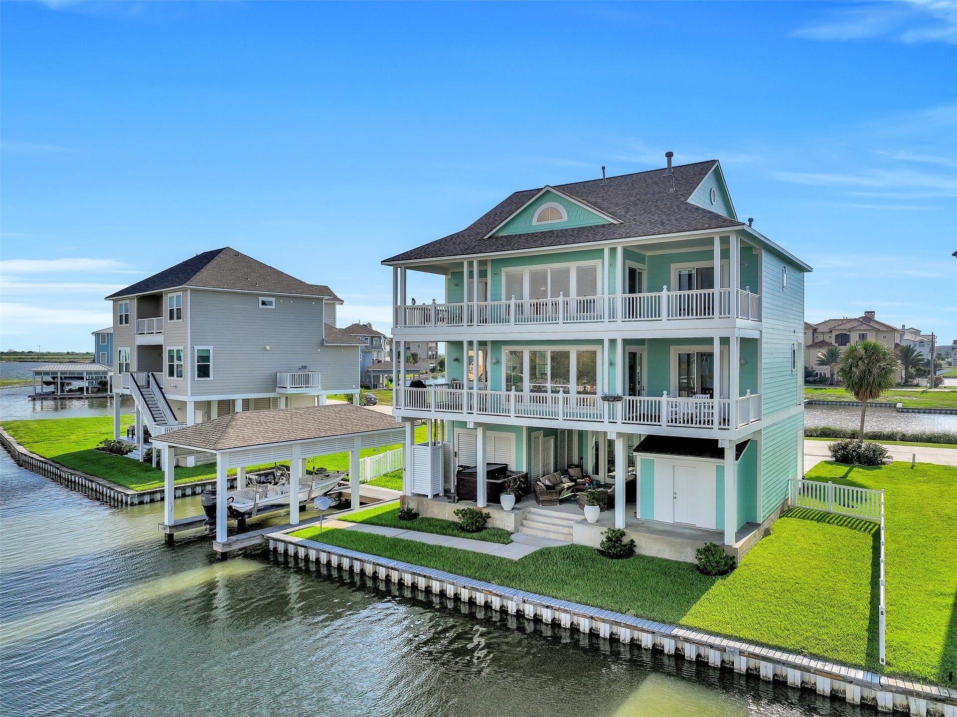 12 Fleming, Hitchcock, TX 77563 Your boat lives here. Private boathouse with a 30-foot electric lift, fully rebuilt dock with treated lumber and stainless steel hardware, and direct canal access to the Intracoastal Waterway this is what Harborwalk living is all about.