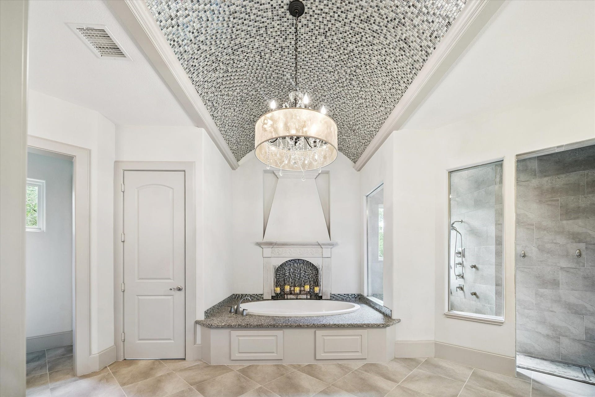 Spa-like primary bathroom with soaking tub, separate shower, and double vanities