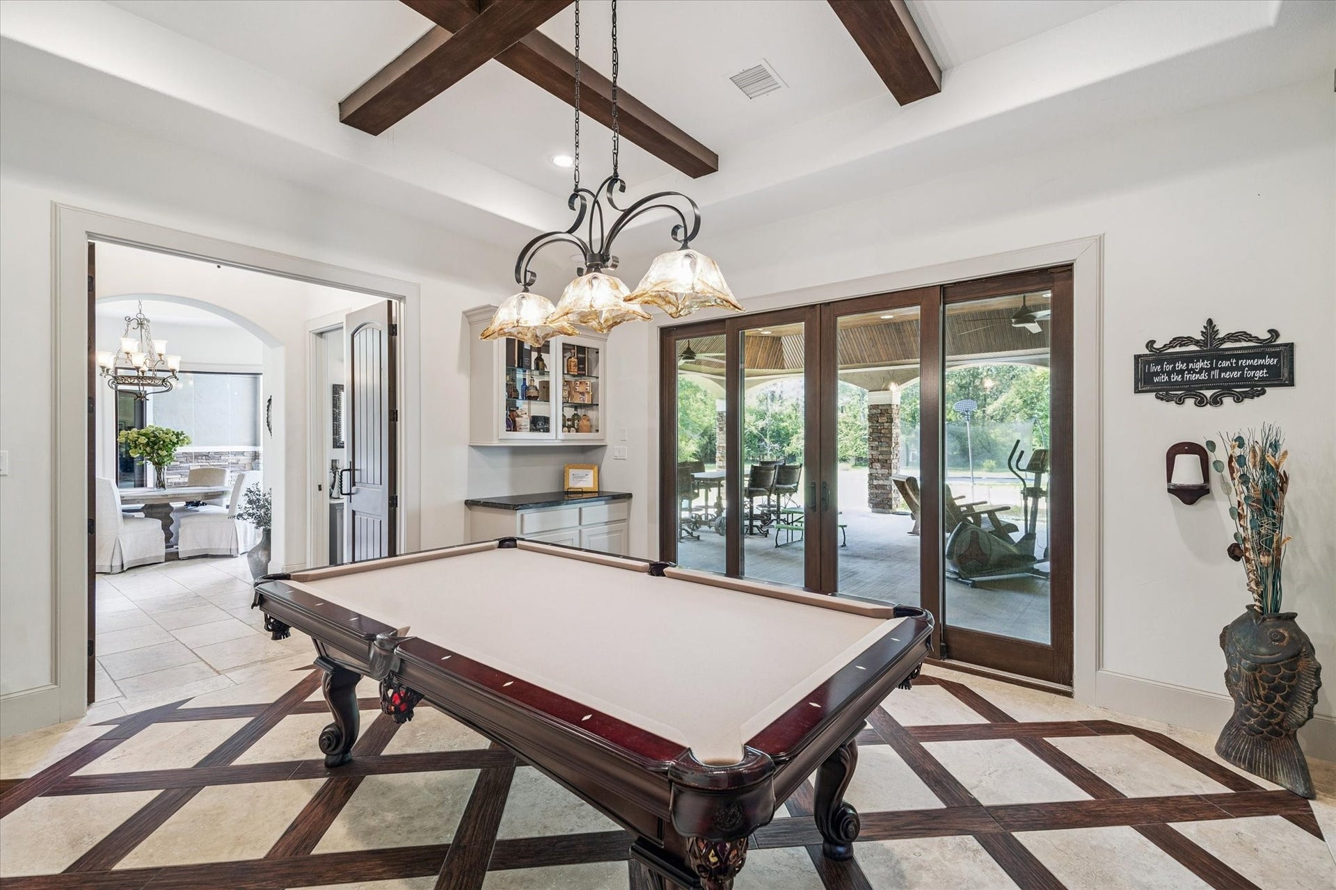Game room on first floor perfect for entertaining right off of outdoor patio