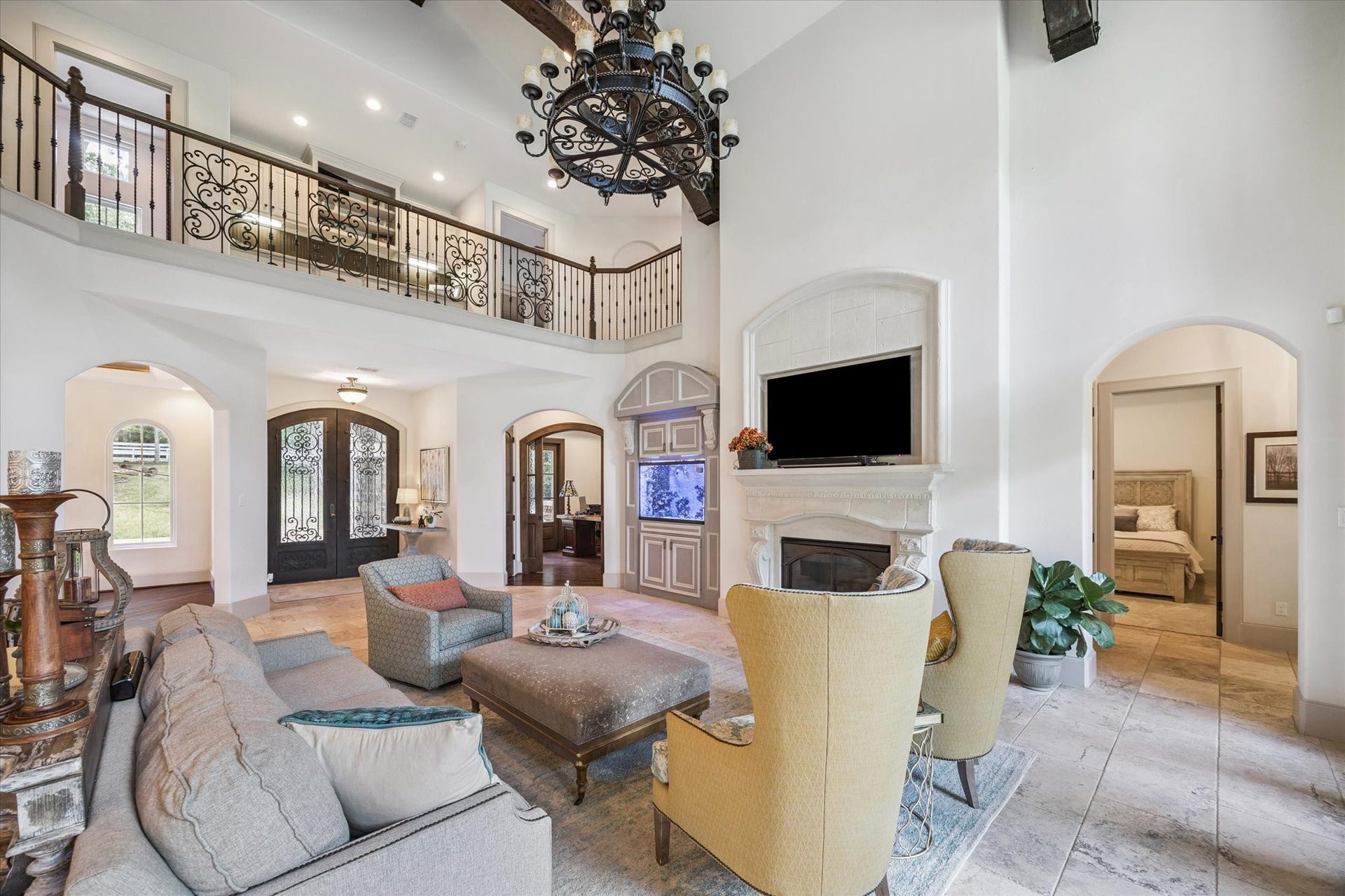 Gorgeous living room off of kitchen with gaslog fireplace, abundant natural light, and high ceilings