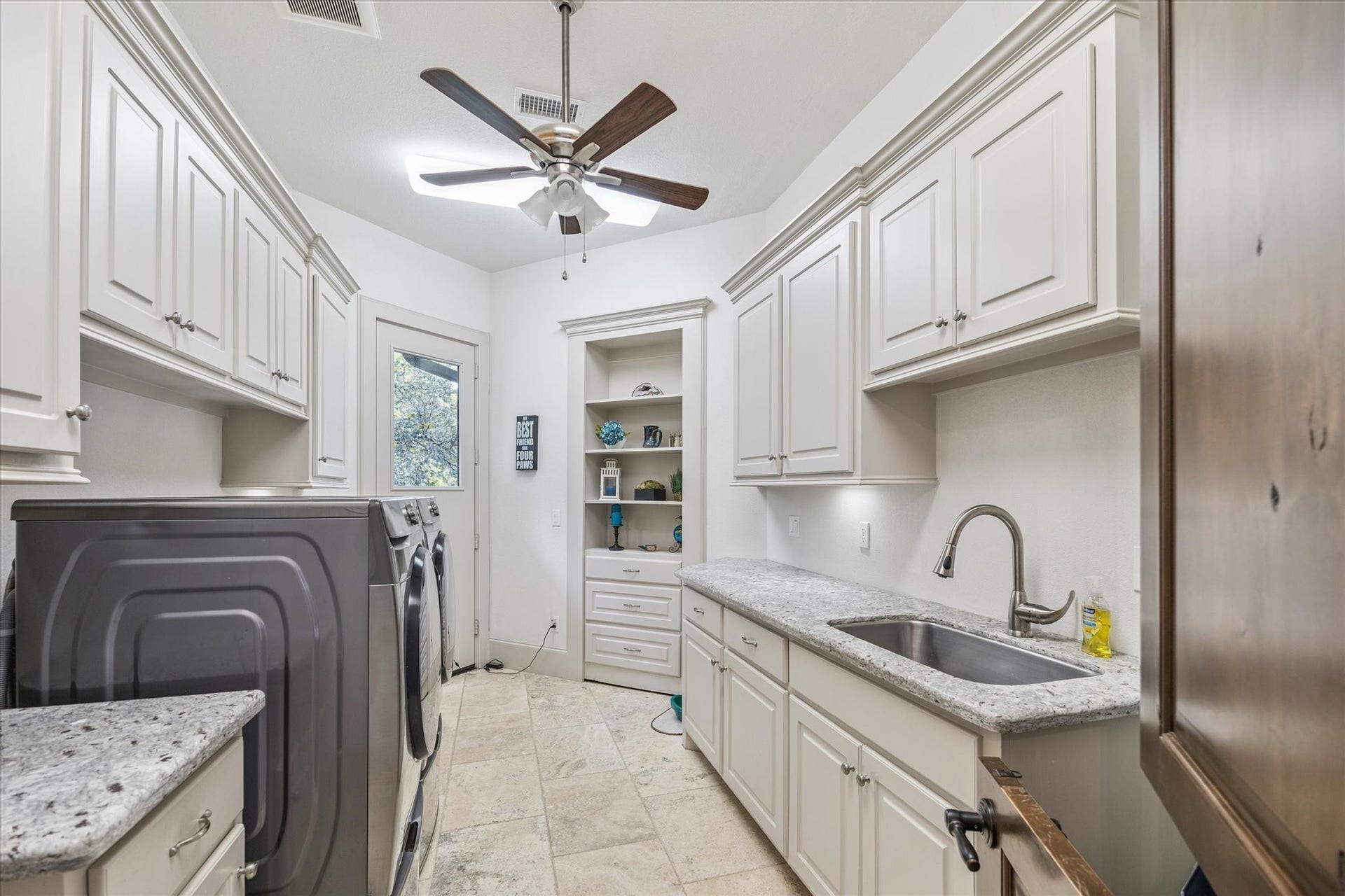 Laundry room located on first floor with door to primary bedroom closet.