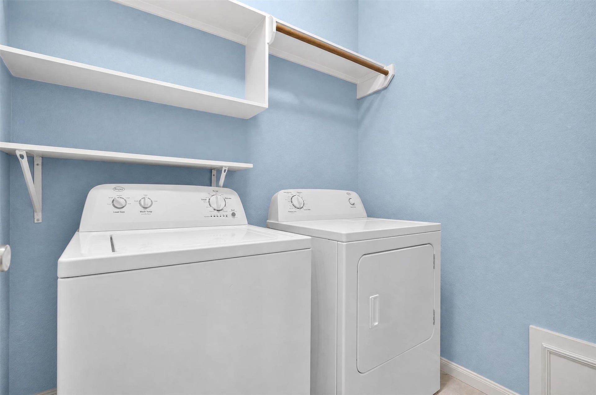 1306 N Gabriel River Circle, Sugar Land, TX 77478 Spacious laundry room with hangers and shelves for convenience