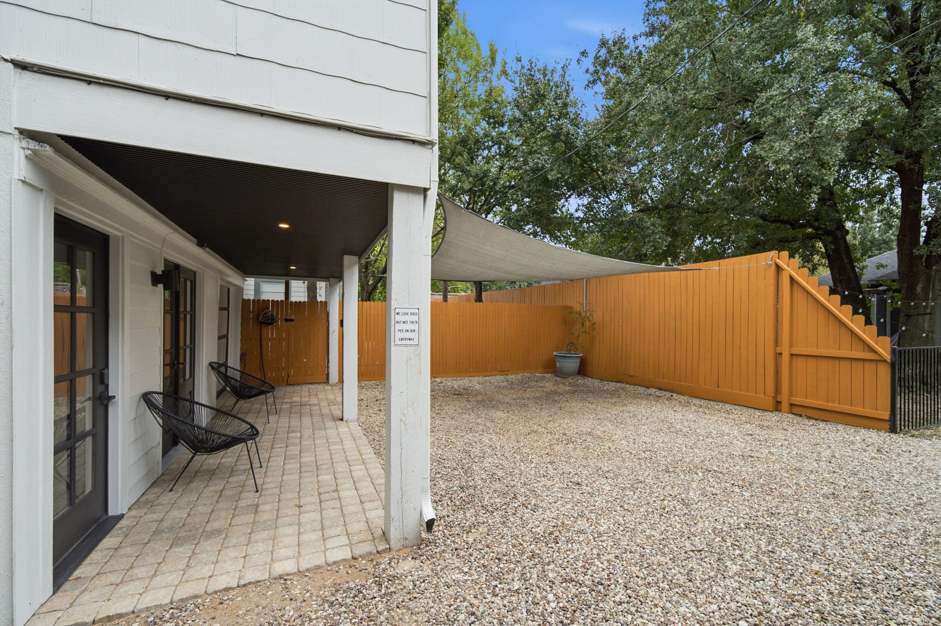 Cute front porch and parking for two cars in front. There is a one car garage that accomodates a smaller car.