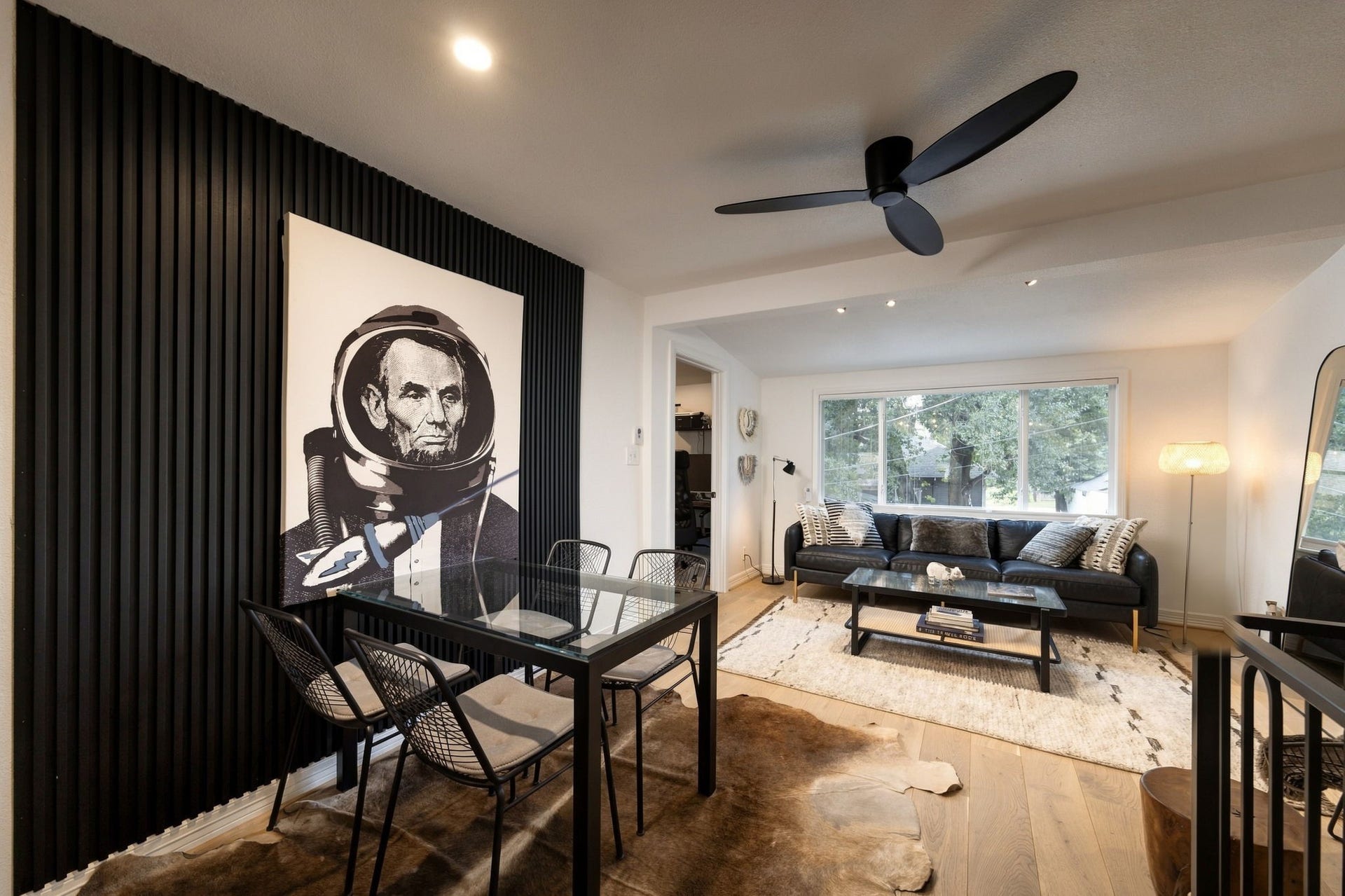 Table for 4 along the fluted wood accent wall.