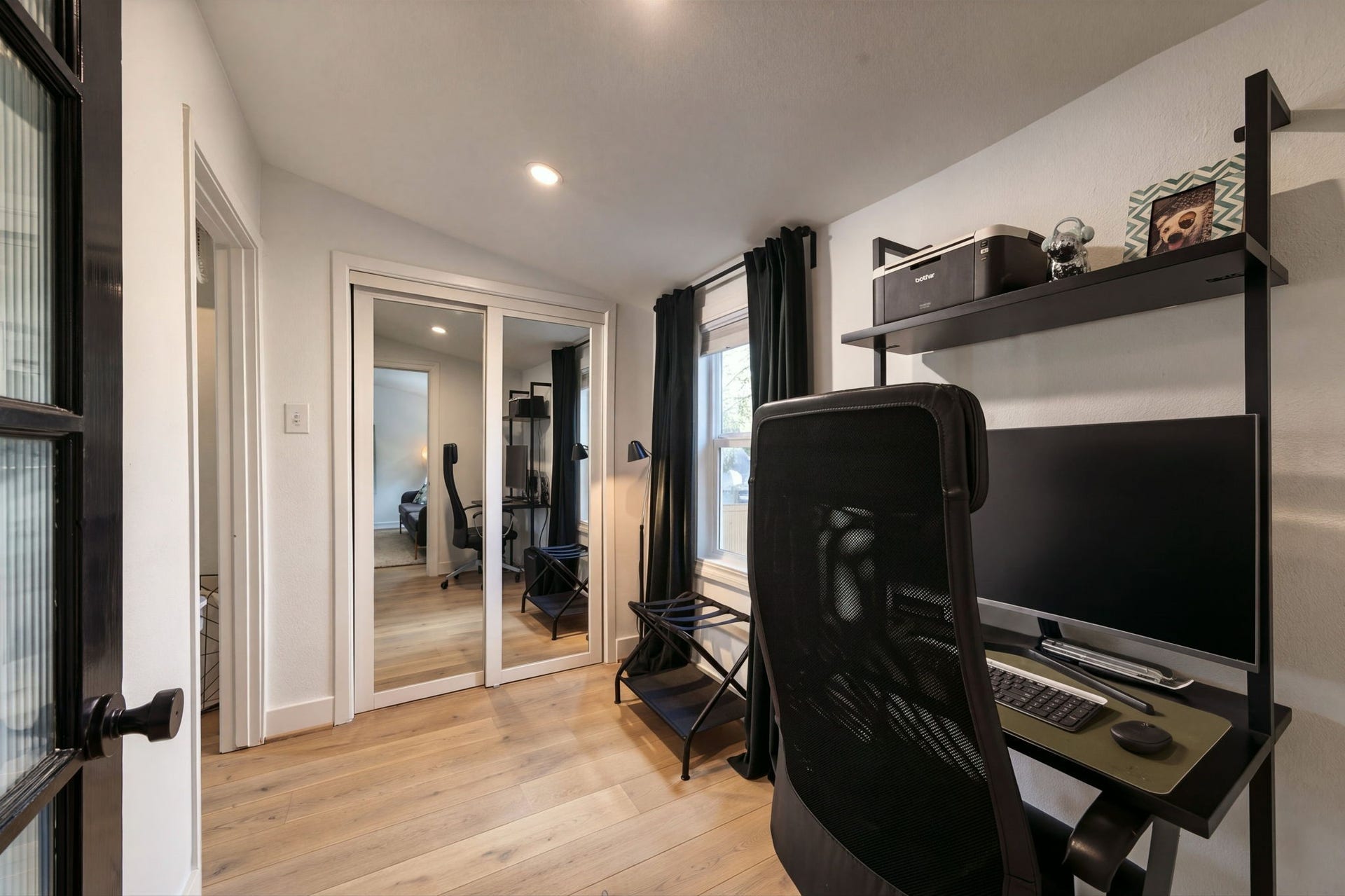 This office area with closet is between the living room and bedroom.