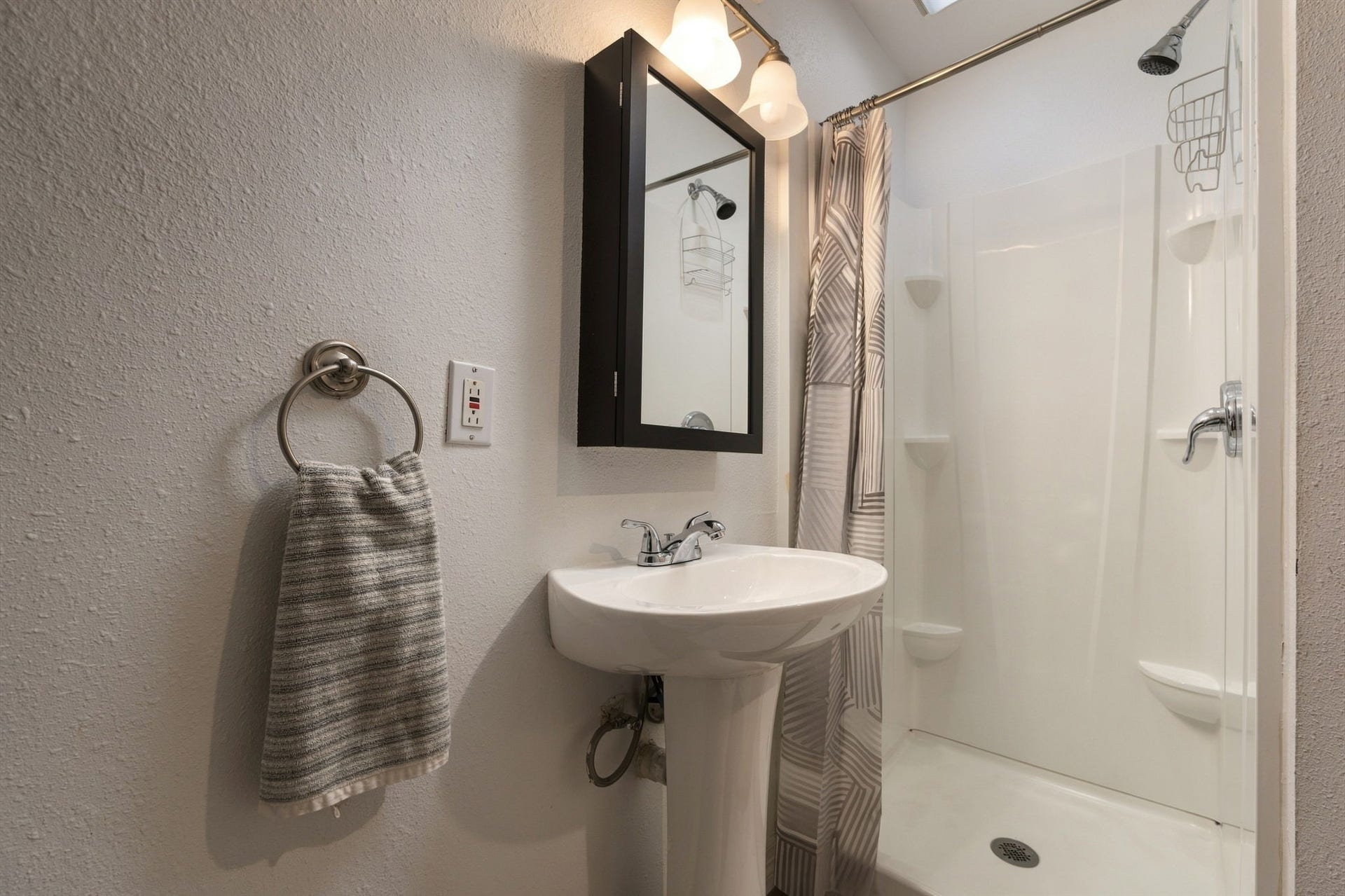 Downstairs bathroom with walk-in shower.