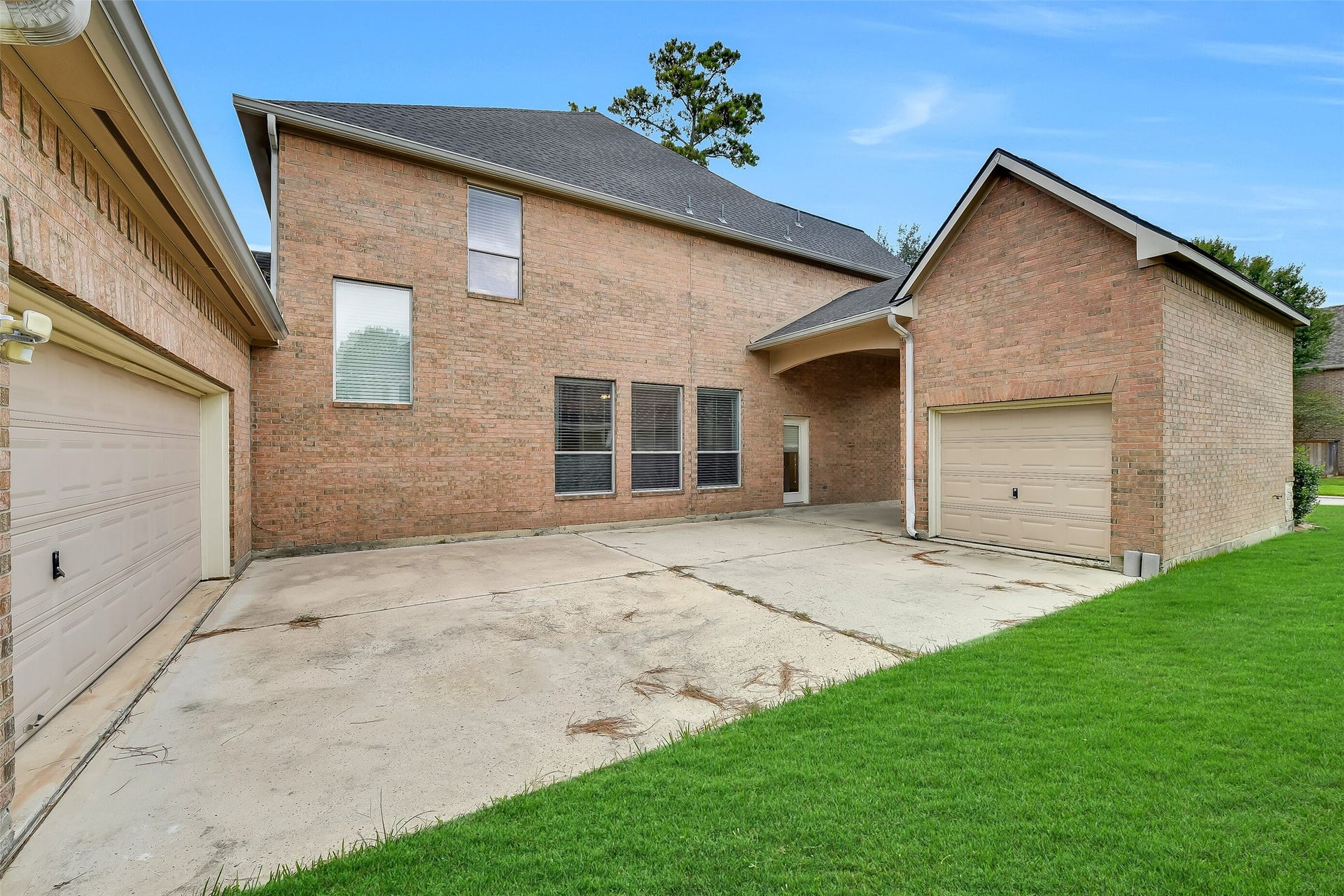 8407 Alyssa Gardens Lane, Humble, TX 77396 A generous paved area between the two garages provides ample parking for additional vehicles or a versatile outdoor venue perfect for crawfish boils and entertaining. Fully fenceable and easily gated for complete privacy