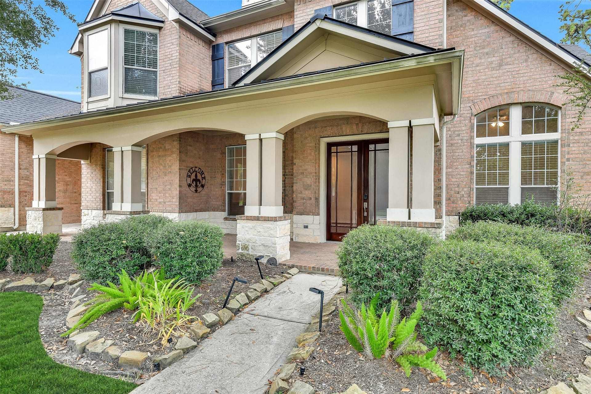 8407 Alyssa Gardens Lane, Humble, TX 77396 This expansive covered porch offers a wonderful outdoor space for relaxing or chatting with neighbors.