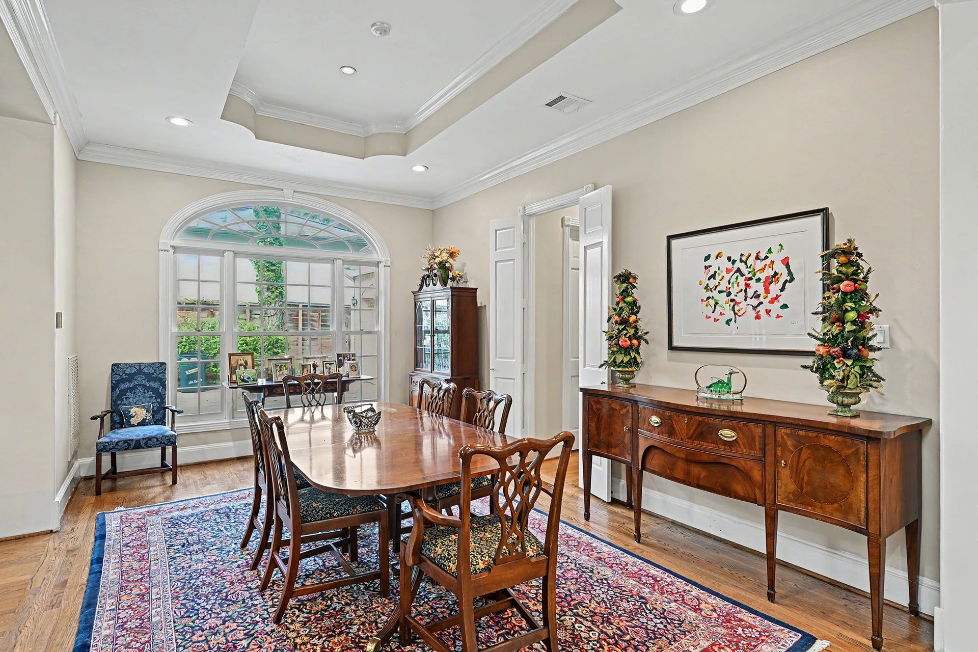 10 Sandalwood Drive, Houston, TX 77024 The formal dining room has 10 ft ceilings and a butler's pantry through the double doors.