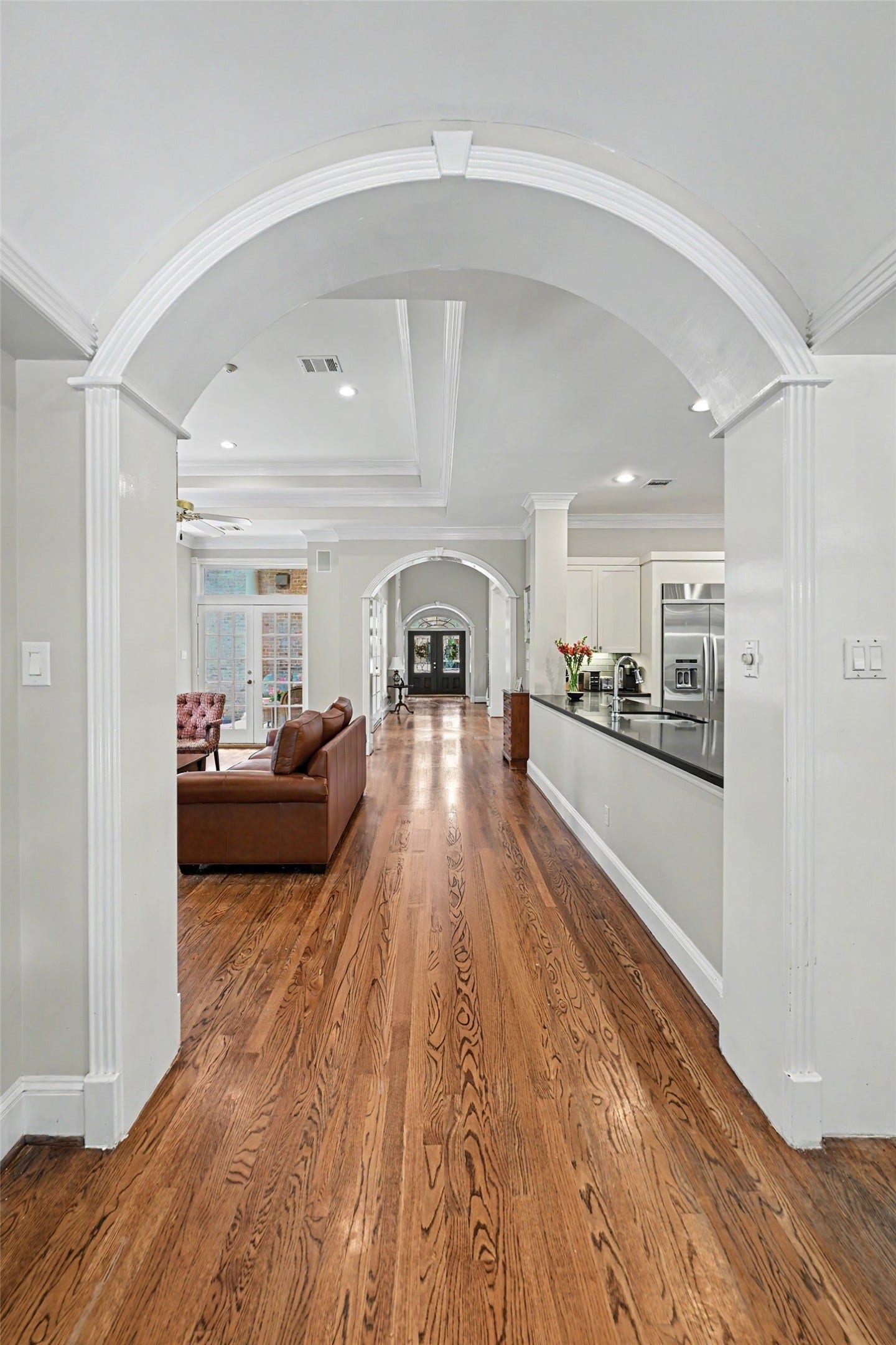 10 Sandalwood Drive, Houston, TX 77024 Stunning gallery hall is the backbone of the symetrical floor plan. Lots of natural light fills the home.