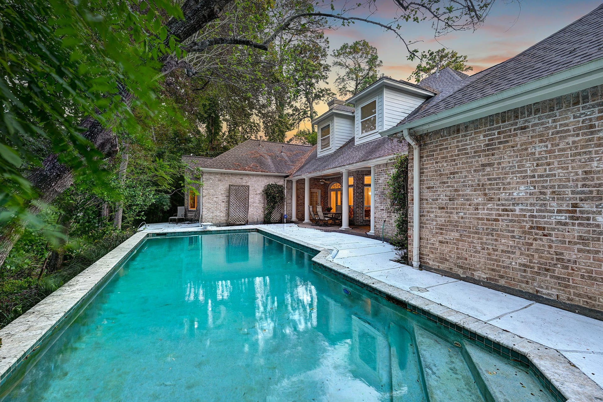 10 Sandalwood Drive, Houston, TX 77024 Private backyard pool has a ravine on the left at the back of the property.