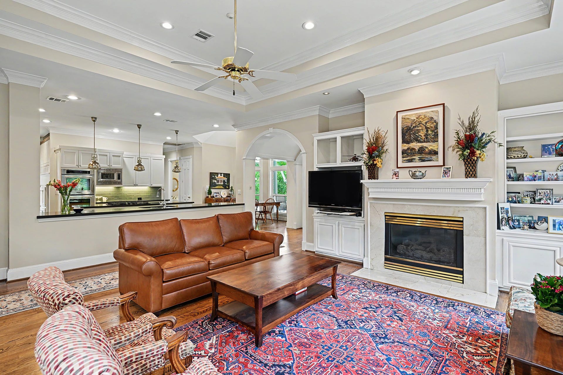 10 Sandalwood Drive, Houston, TX 77024 The family room opens to the island kitchen making it great for entertaining.