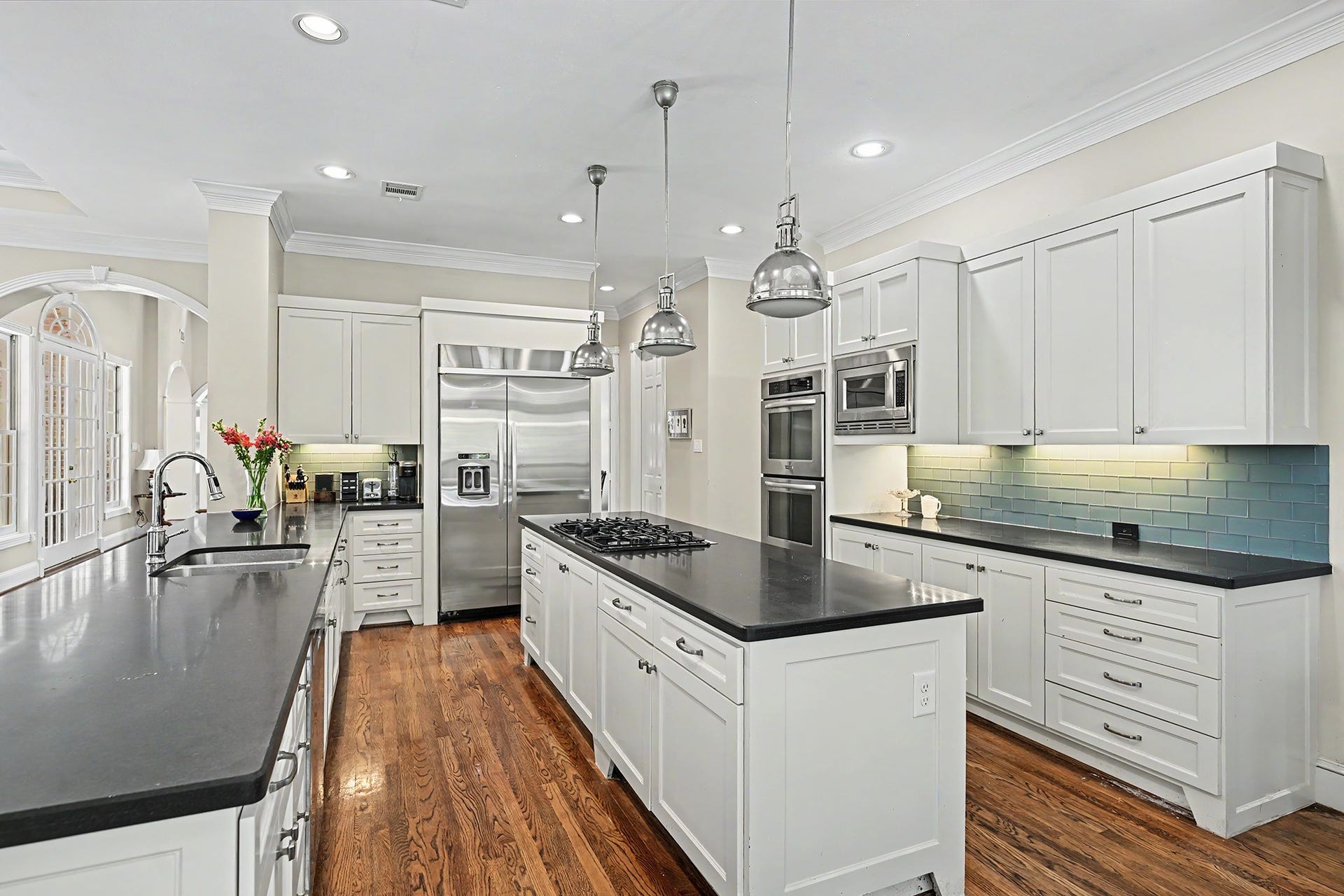 10 Sandalwood Drive, Houston, TX 77024 The kitchen's island with cooktop and ample drawer and cabinet space is perfect for the home chef.