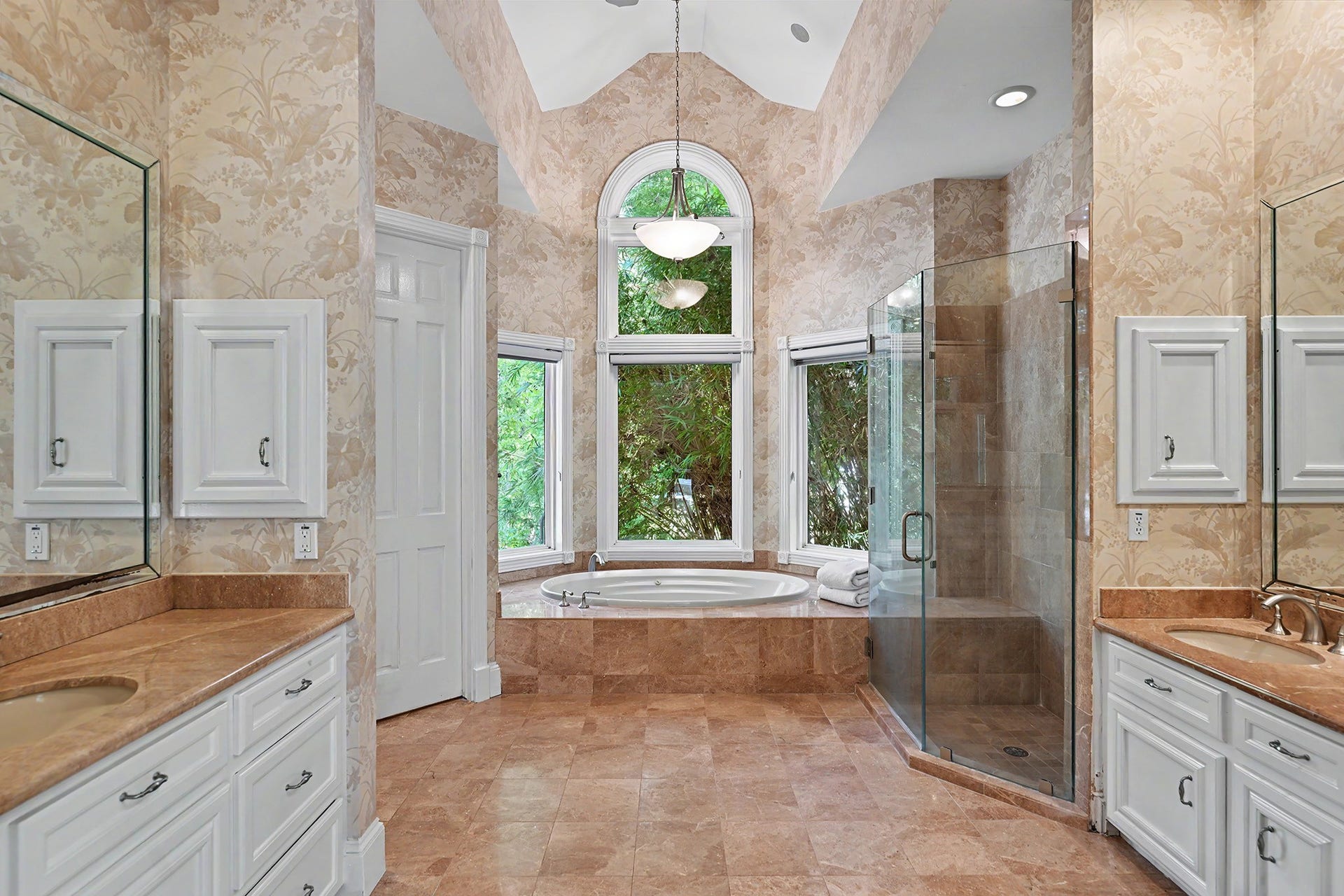10 Sandalwood Drive, Houston, TX 77024 The primary bathroom is your private spa with marble counters, soothing colors and two walk-in closets.